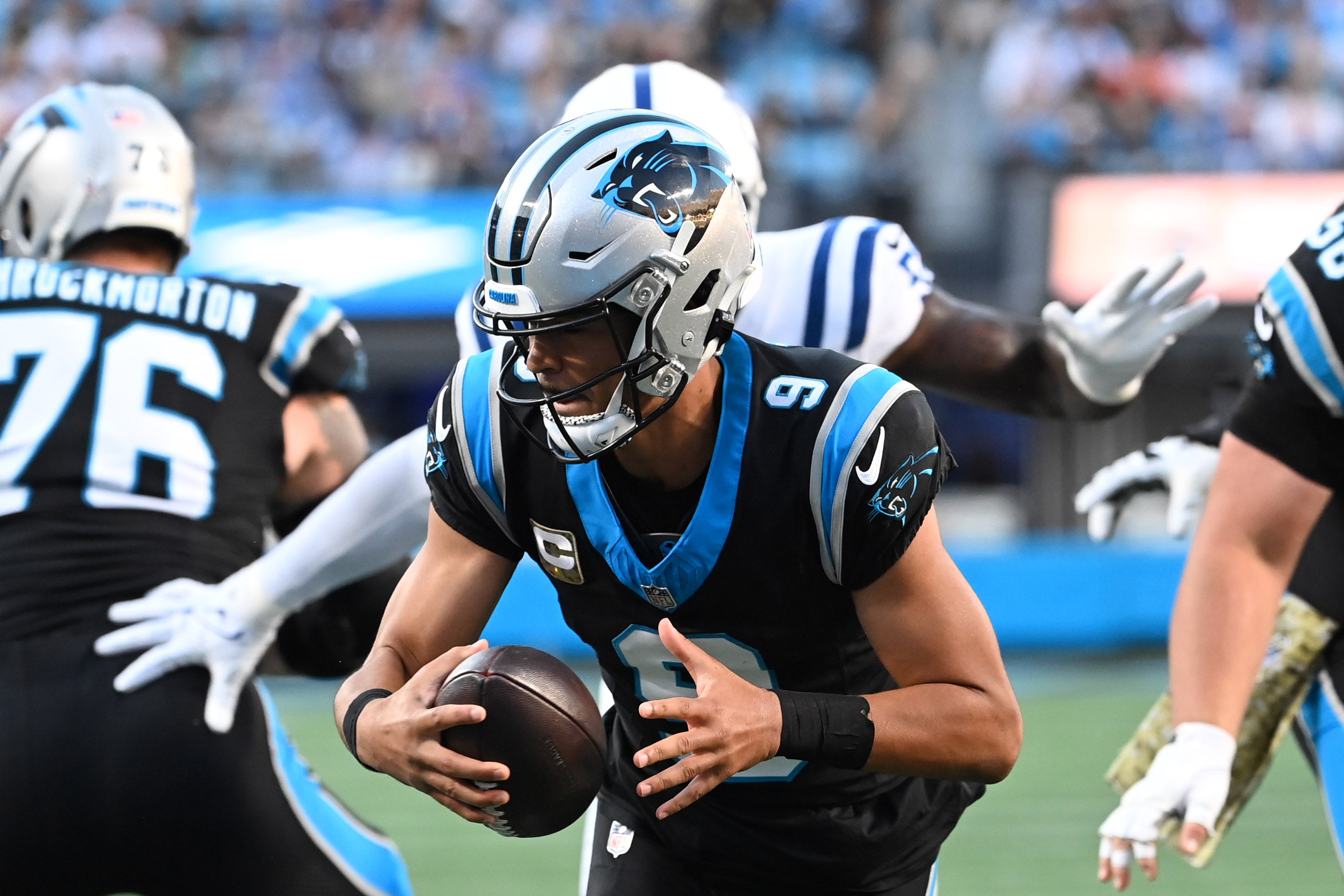 Nov 5, 2023; Charlotte, North Carolina, USA; Carolina Panthers quarterback Bryce Young (9) with the ball as Indianapolis Colts defensive end Kwity Paye (51) pressures in the first quarter at Bank of America Stadium. Mandatory Credit: Bob Donnan-USA TODAY Sports