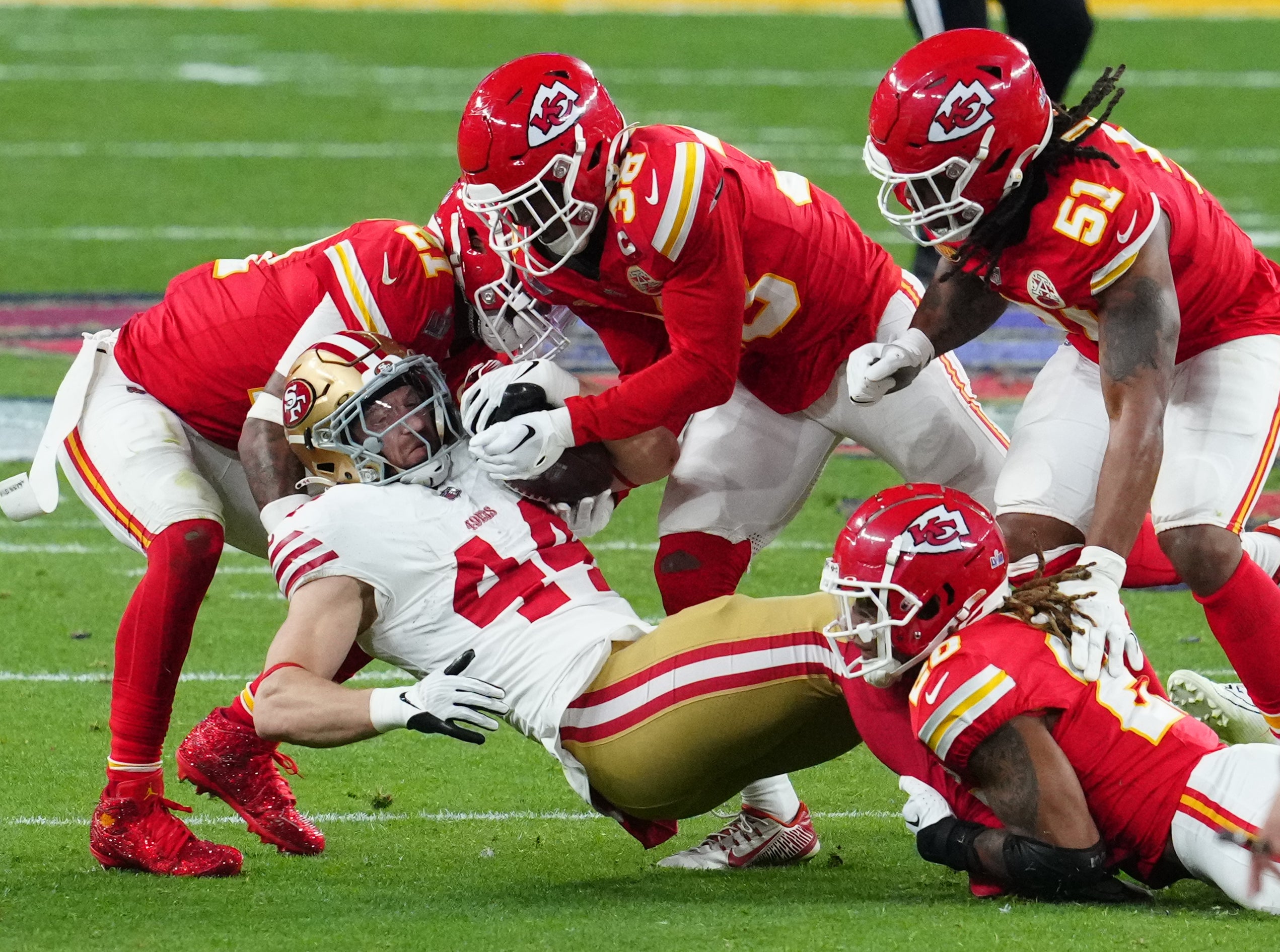 Feb 11, 2024; Paradise, Nevada, USA; San Francisco 49ers fullback Kyle Juszczyk (44) makes a catch between Kansas City Chiefs defenders in the second half in Super Bowl LVIII at Allegiant Stadium. Mandatory Credit: Stephen R. Sylvanie-USA TODAY Sports  