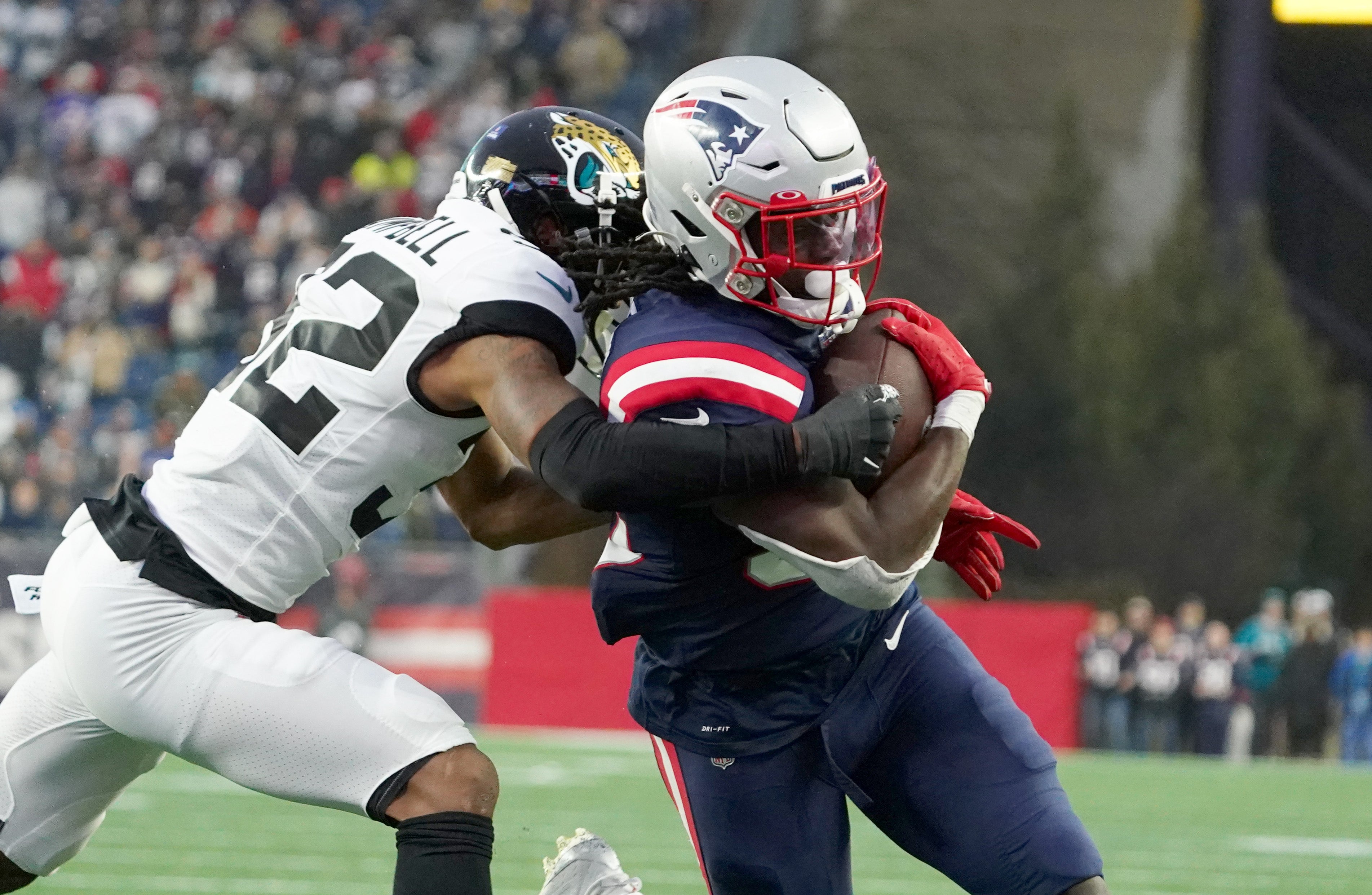 Jan 2, 2022; Foxborough, Massachusetts, USA; New England Patriots running back Rhamondre Stevenson (38) runs for a touchdown against the Jacksonville Jaguars in the second half at Gillette Stadium.