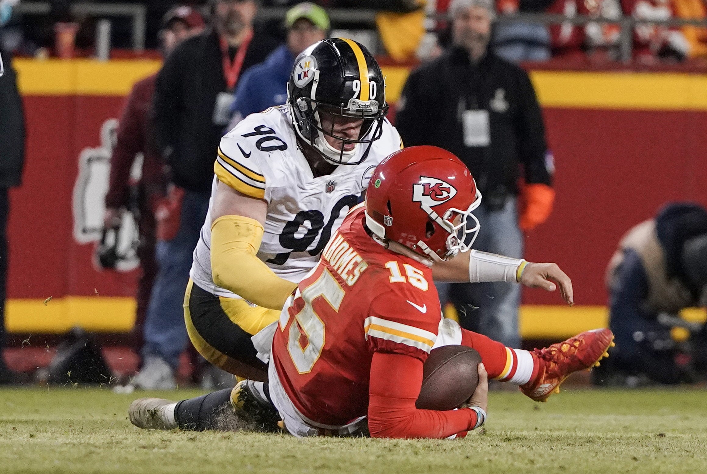 Jan 16, 2022; Kansas City, Missouri, USA; Kansas City Chiefs quarterback Patrick Mahomes (15) is sacked by Pittsburgh Steelers outside linebacker T.J. Watt (90) in an AFC Wild Card playoff football game at GEHA Field at Arrowhead Stadium. Mandatory Credit: Denny Medley-USA TODAY Sports