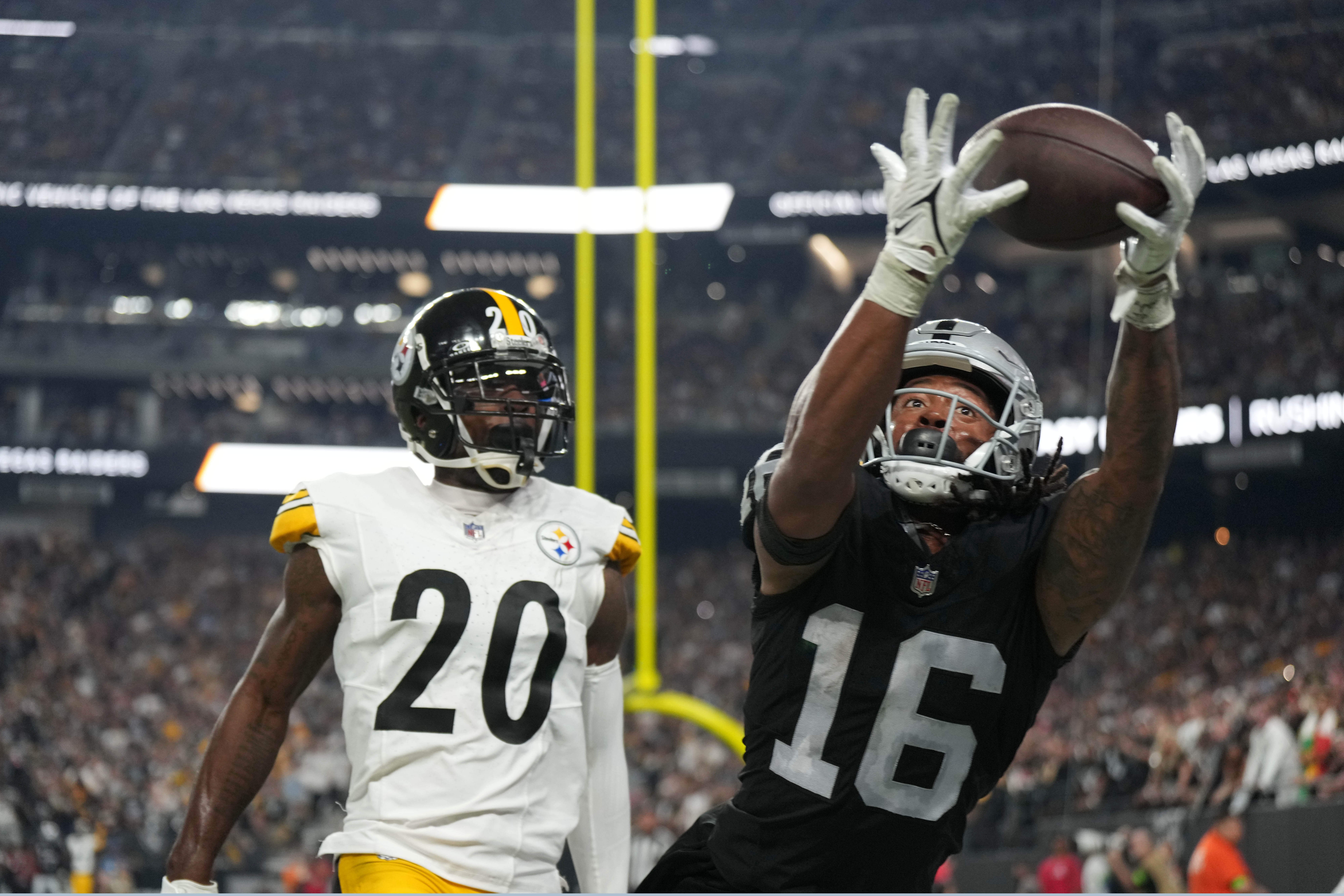 Sep 24, 2023; Paradise, Nevada, USA; Las Vegas Raiders wide receiver Jakobi Meyers (16) attempts to catch the ball against Pittsburgh Steelers cornerback Patrick Peterson (20) at Allegiant Stadium. Mandatory Credit: Kirby Lee-USA TODAY Sports