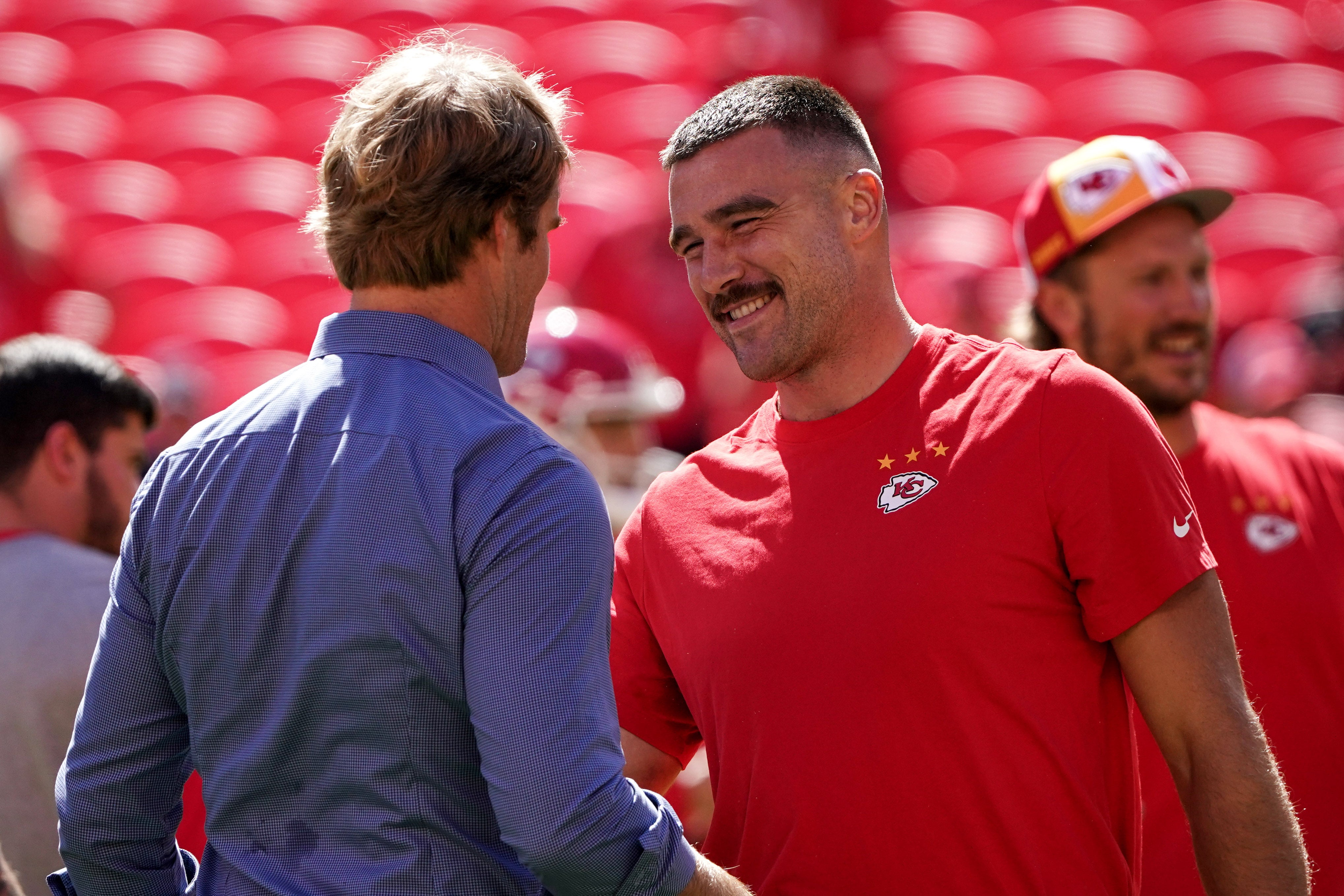Sep 24, 2023; Kansas City, Missouri, USA; Sports broadcaster Greg Olsen talks with Kansas City Chiefs tight end Travis Kelce (87) against the Chicago Bears prior to a game at GEHA Field at Arrowhead Stadium.