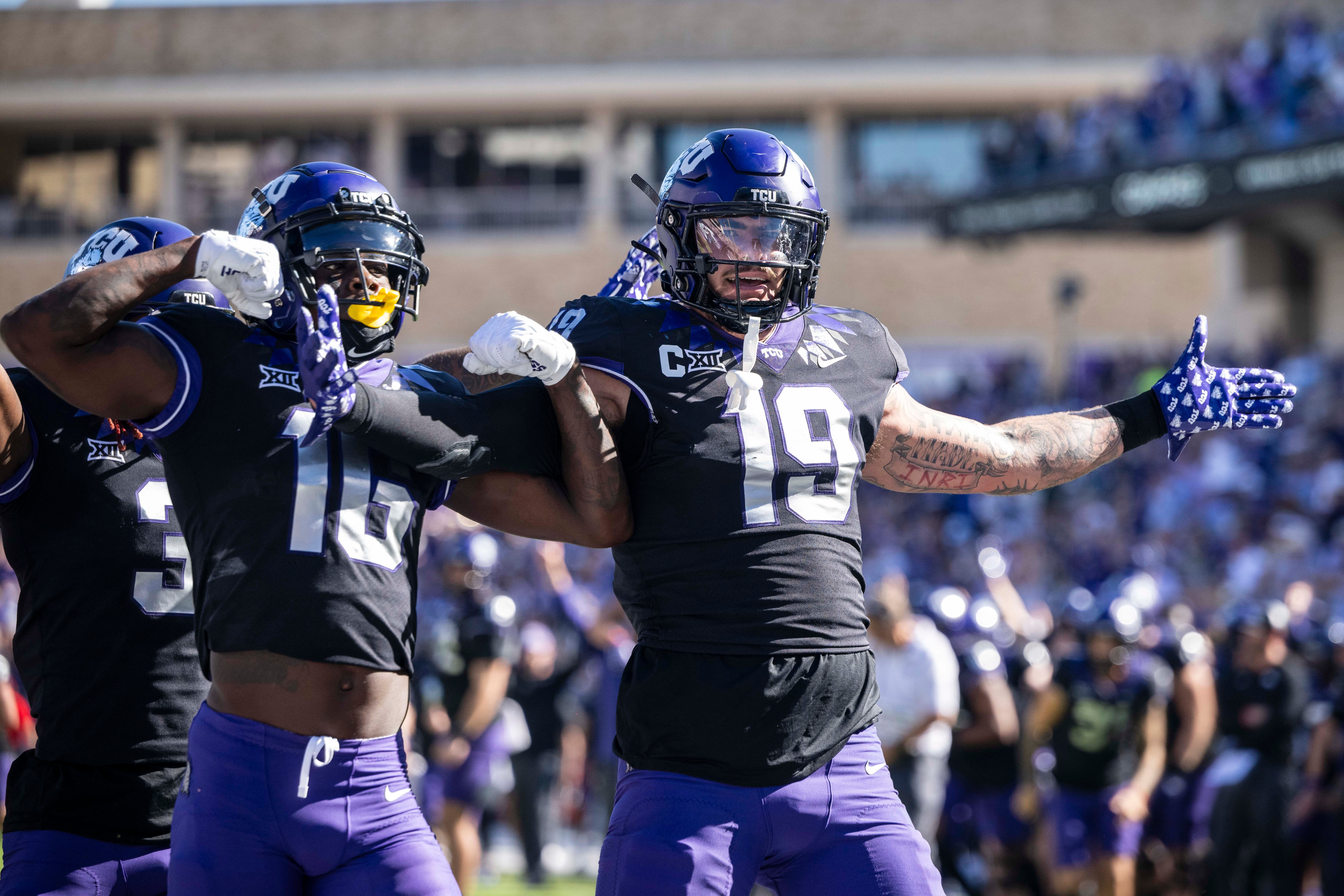 Oct 14, 2023; Fort Worth, Texas, USA; TCU Horned Frogs tight end Jared Wiley (19) and wide receiver Dylan Wright (16) celebrate after Wiley scores a touchdown against the Brigham Young Cougars during the game at Amon G. Carter Stadium.