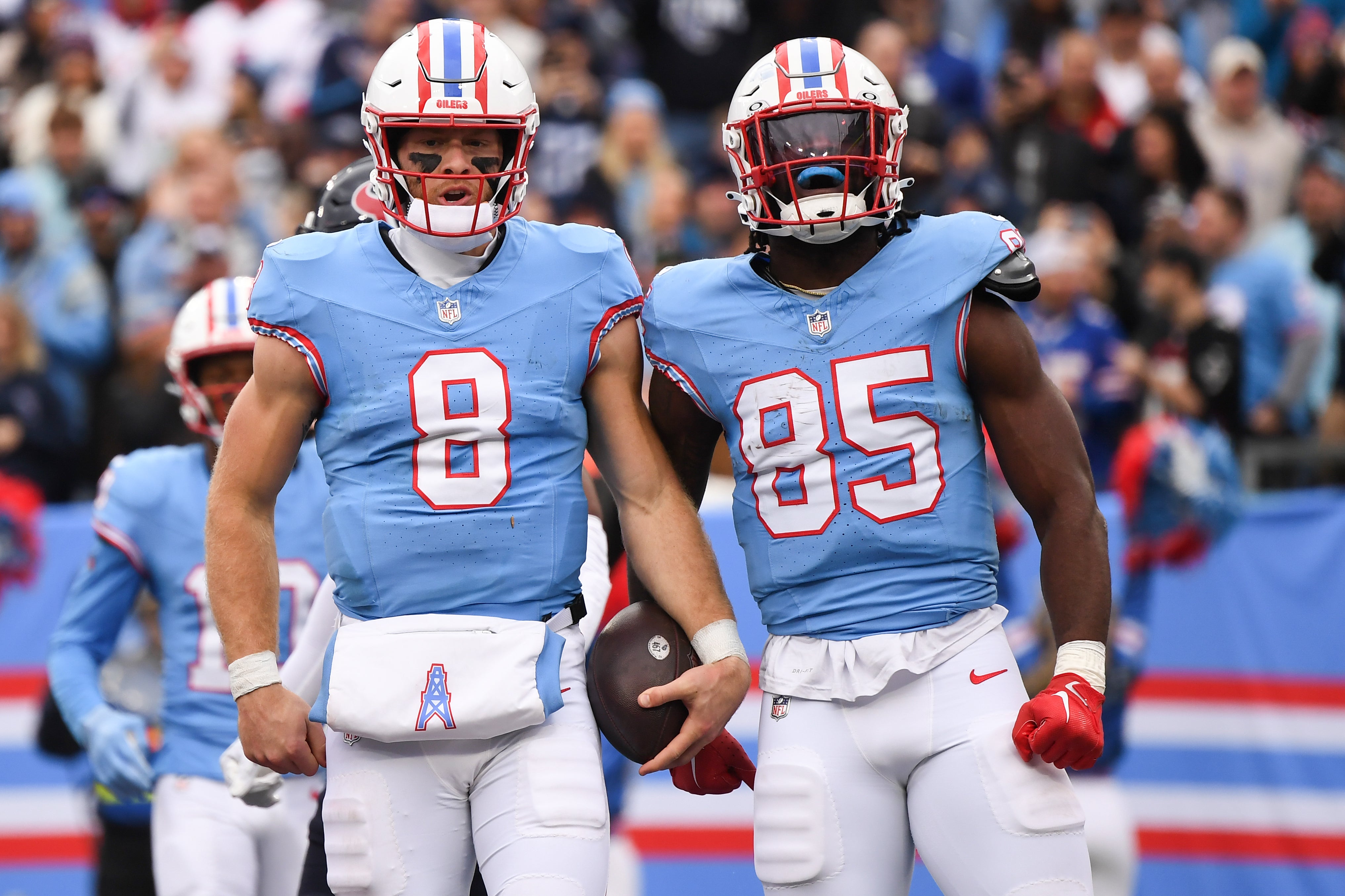 Dec 17, 2023; Nashville, Tennessee, USA; Tennessee Titans quarterback Will Levis (8) and tight end Chigoziem Okonkwo (85) celebrate after a touchdown during the first half against the Houston Texans at Nissan Stadium.