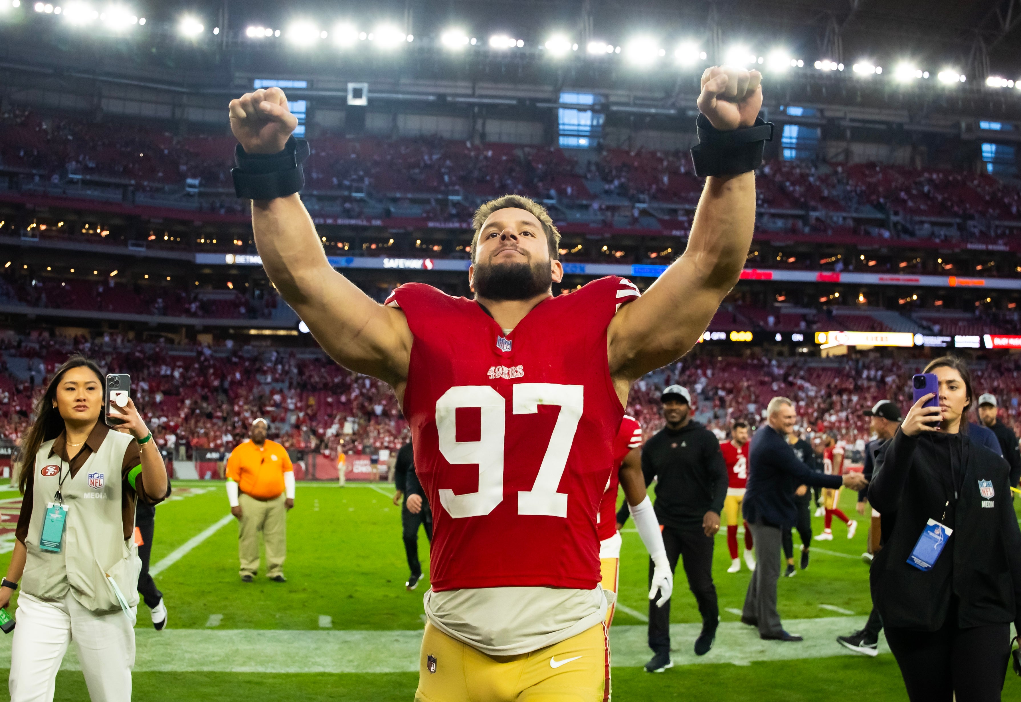 Dec 17, 2023; Glendale, Arizona, USA; San Francisco 49ers defensive end Nick Bosa (97) celebrates after defeating the Arizona Cardinals at State Farm Stadium.