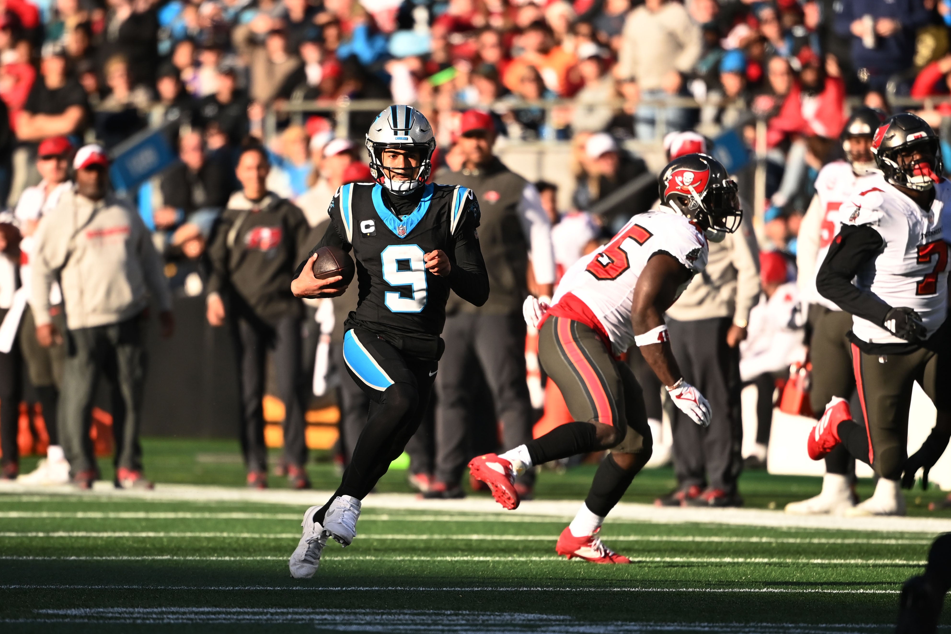 Jan 7, 2024; Charlotte, North Carolina, USA; Carolina Panthers quarterback Bryce Young (9) scrambles in the fourth quarter at Bank of America Stadium. Mandatory Credit: Bob Donnan-USA TODAY Sports