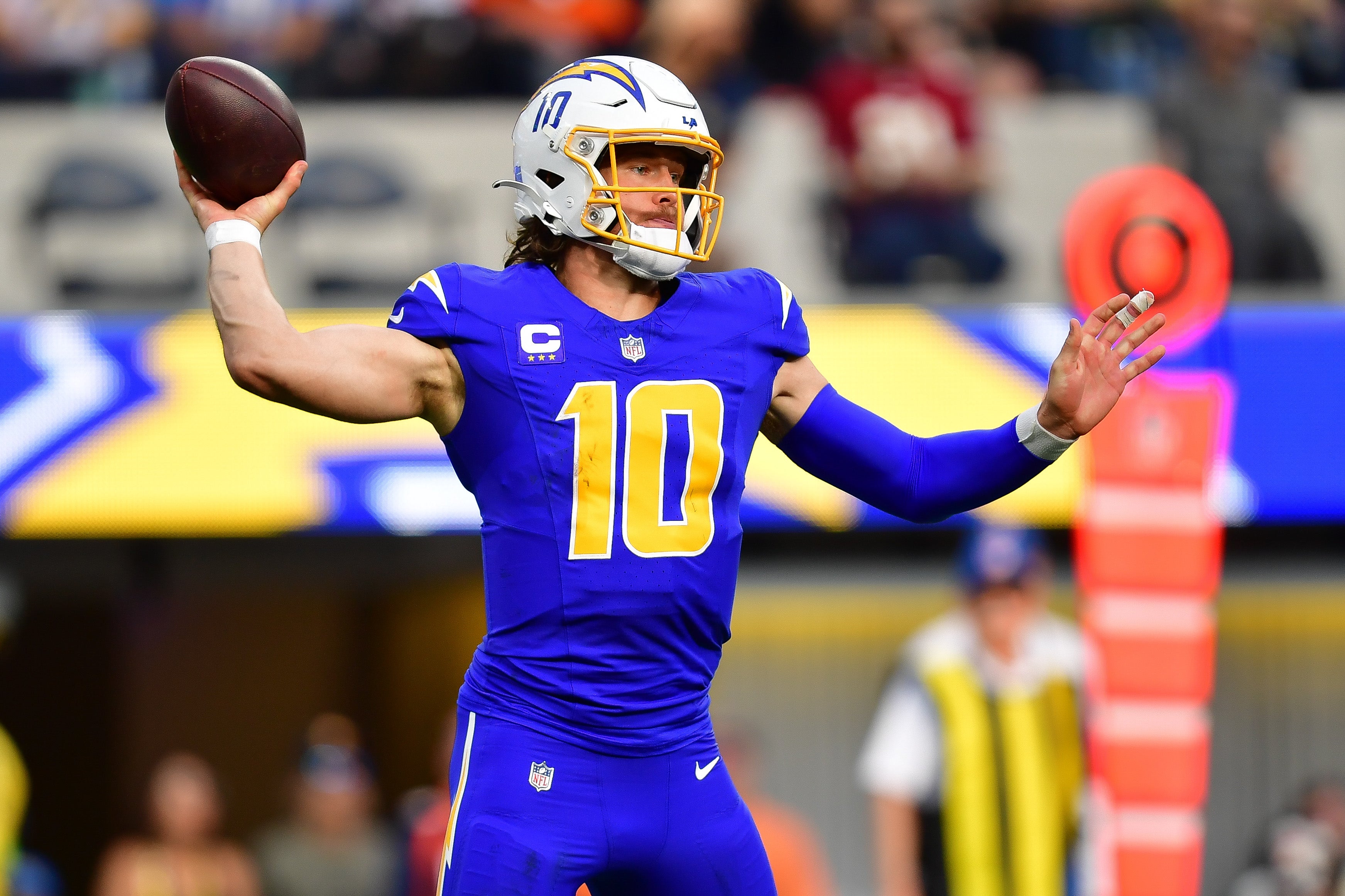 Dec 10, 2023; Inglewood, California, USA; Los Angeles Chargers quarterback Justin Herbert (10) throws against the Denver Broncos during the first half at SoFi Stadium.