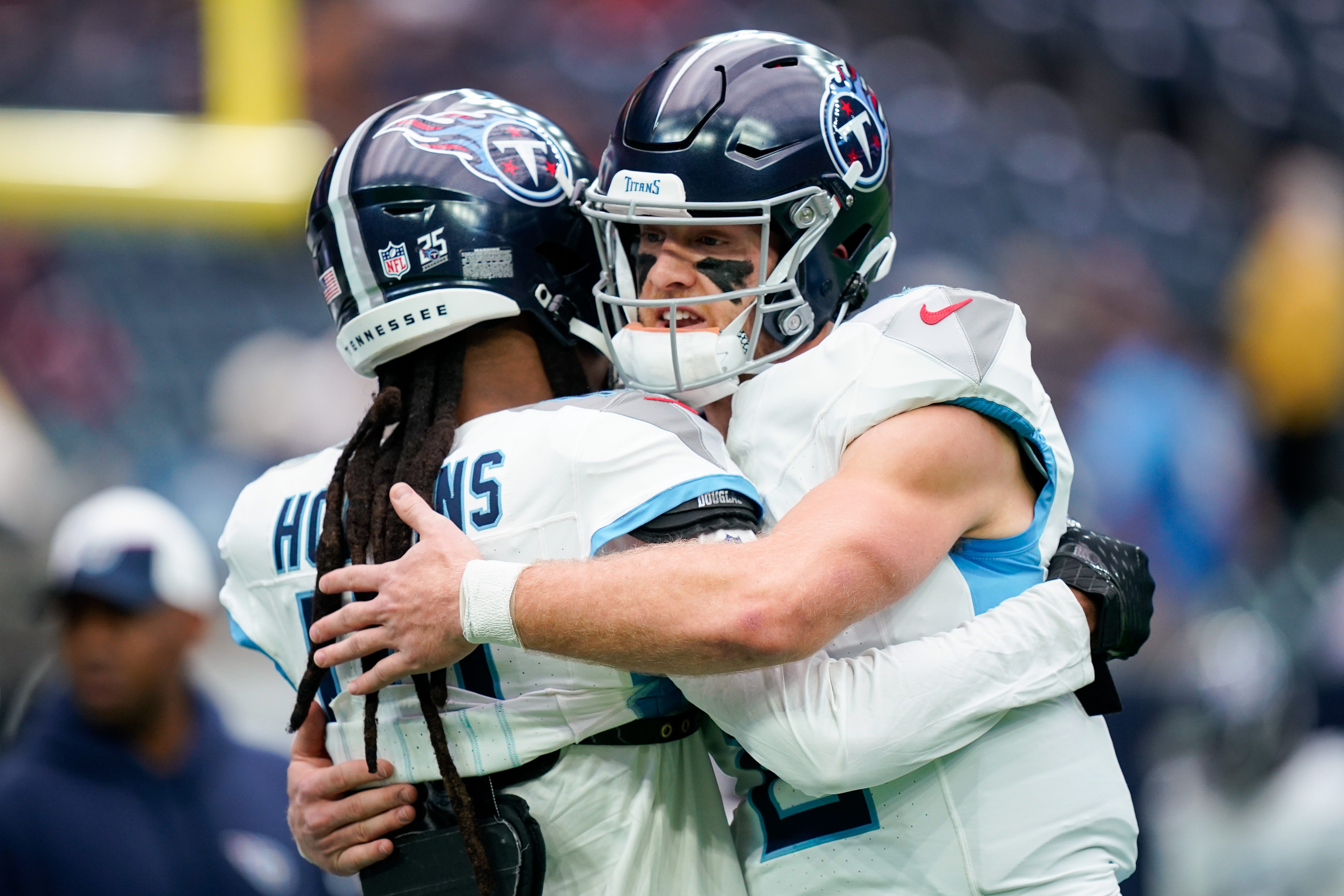Tennessee Titans quarterback Will Levis (8) hugs wide receiver DeAndre Hopkins (10) before a game against the Houston Texans at NRG Stadium in Houston, Texas., Sunday, Dec. 31, 2023.