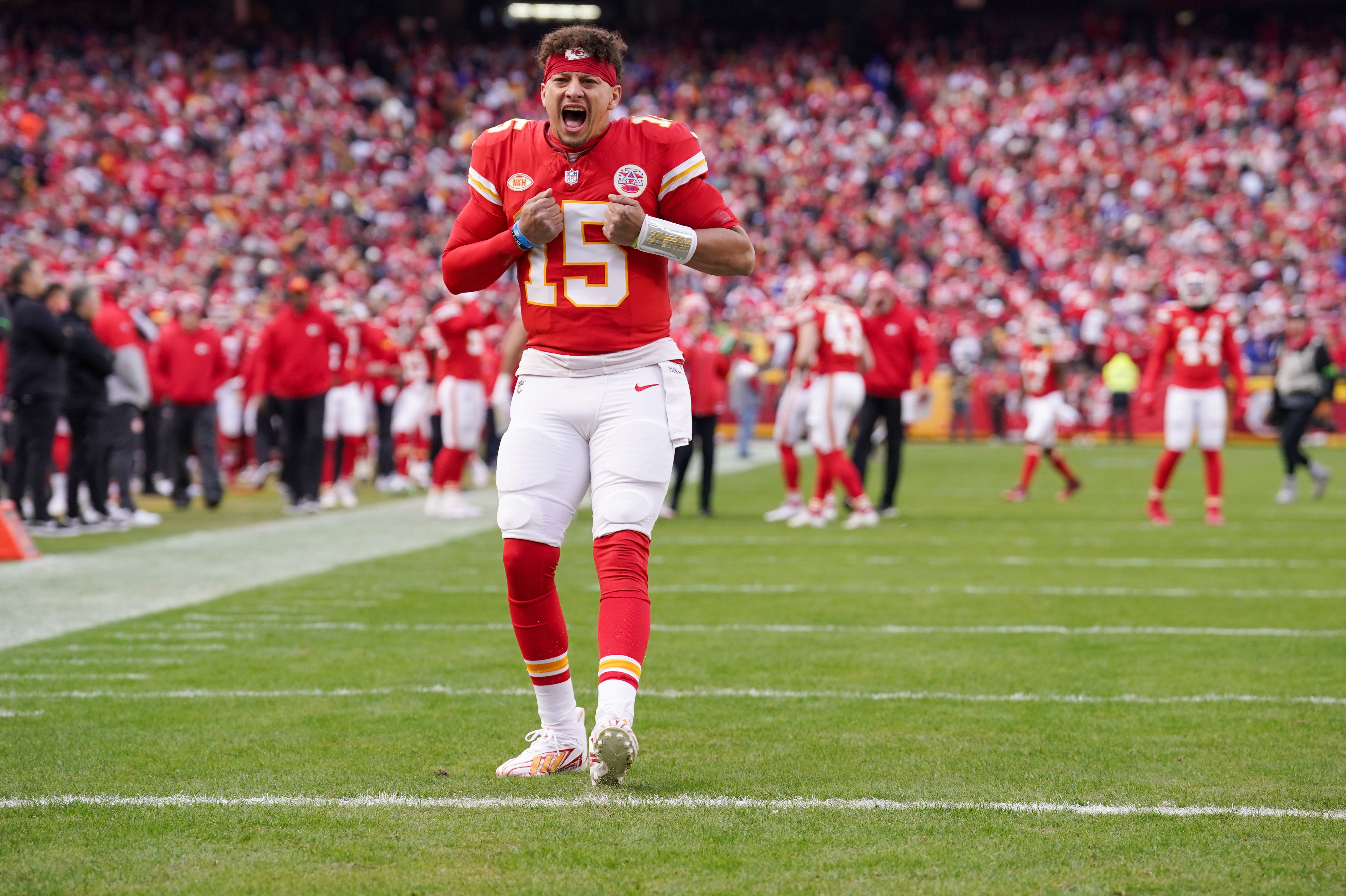 Dec 10, 2023; Kansas City, Missouri, USA; Kansas City Chiefs quarterback Patrick Mahomes (15) celebrates toward fans against the Buffalo Bills prior to a game at GEHA Field at Arrowhead Stadium.