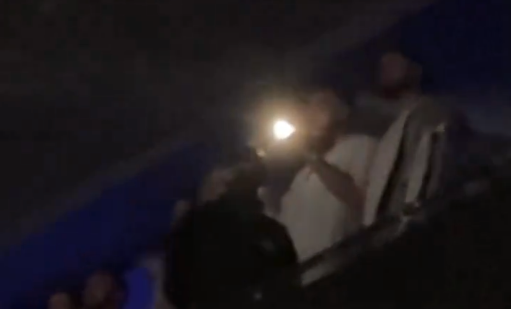 Travis Kelce was caught filming Taylor Swift with his flash on while at her latest Eras Tour show