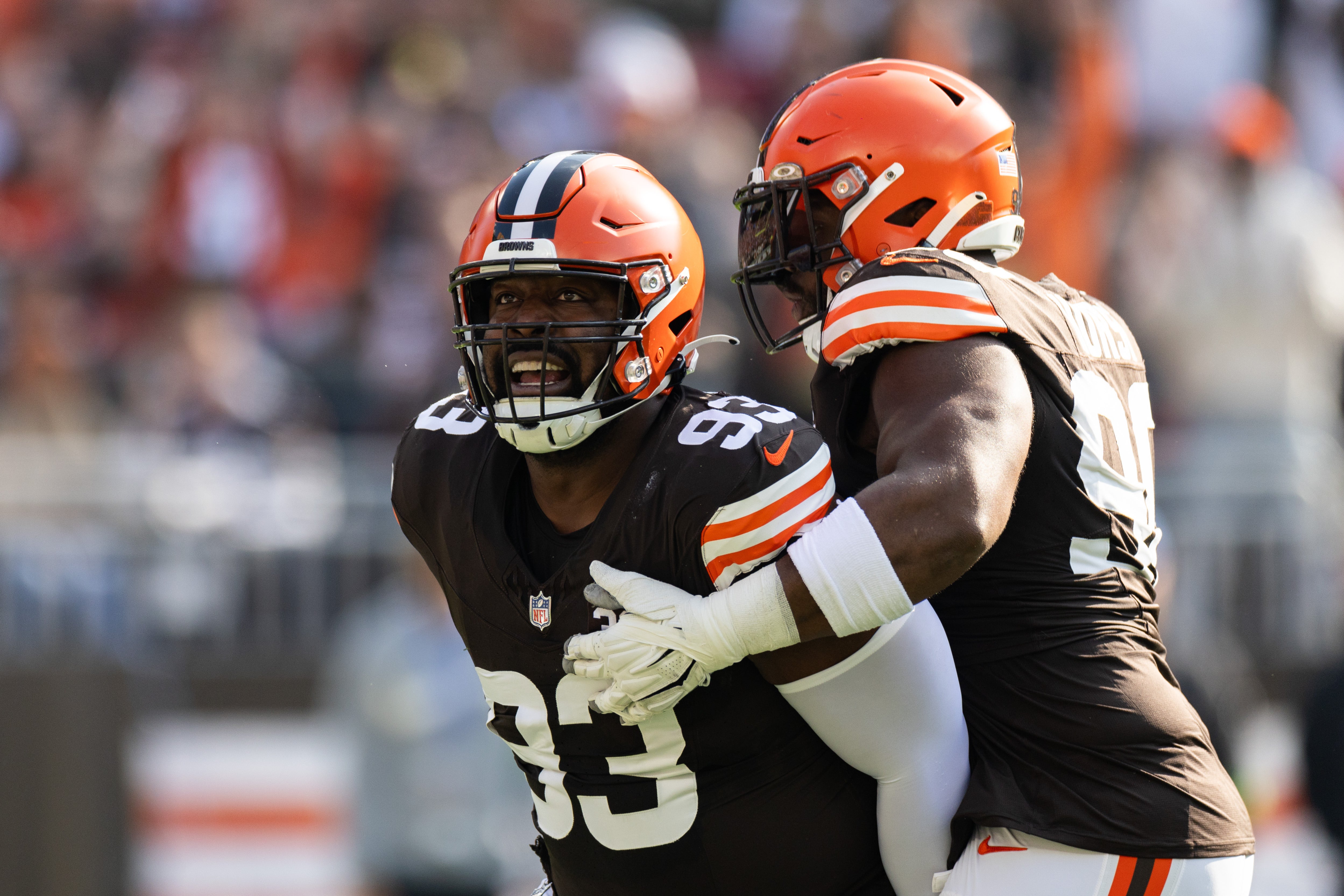 Nov 5, 2023; Cleveland, Ohio, USA; Cleveland Browns defensive tackle Shelby Harris (93) celebrates his tackle for loss as defensive tackle Maurice Hurst II (90) congratulates him against the Arizona Cardinals during the first quarter at Cleveland Browns Stadium. Mandatory Credit: Scott Galvin-USA TODAY Sports