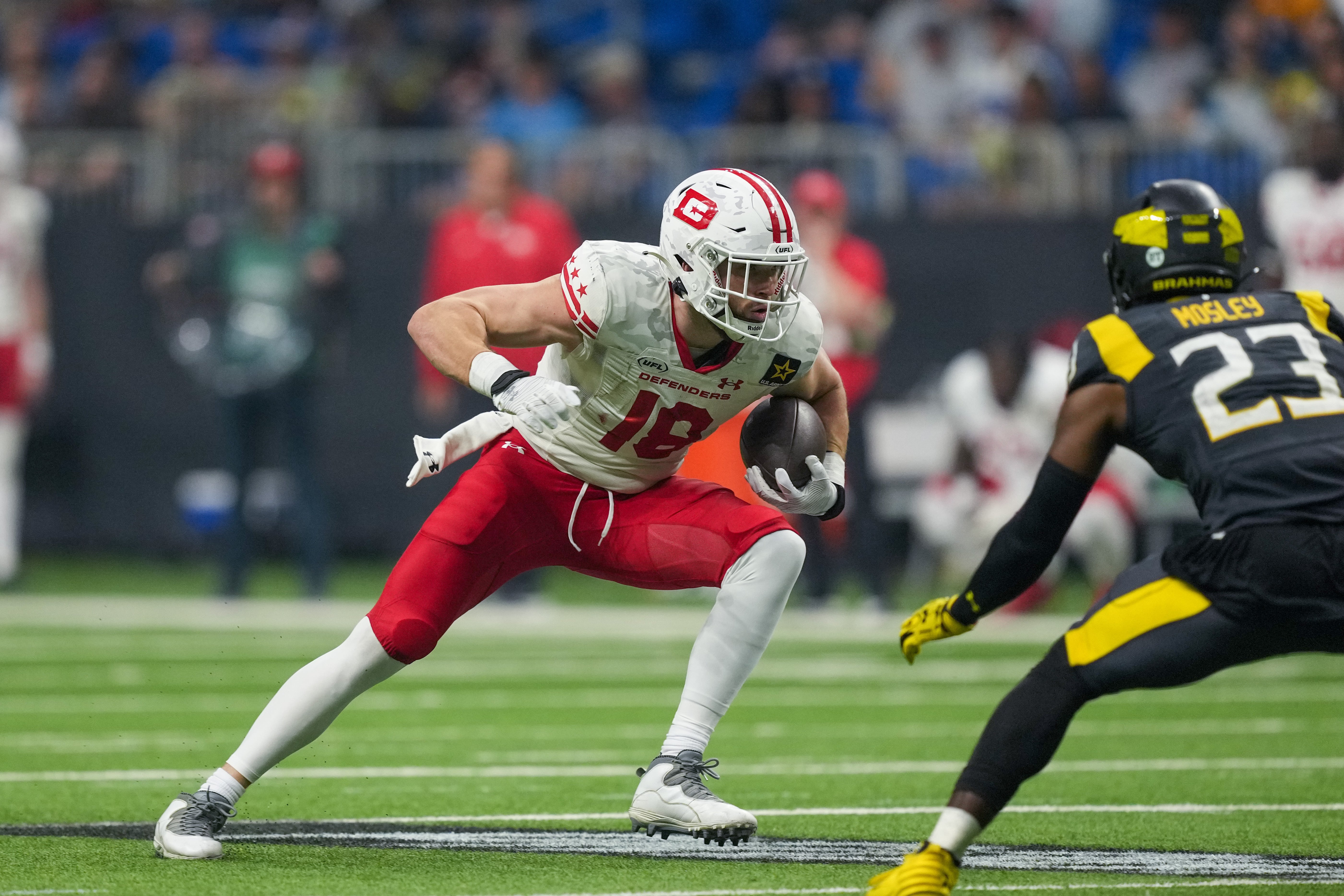 Mar 31, 2024; San Antonio, TX, USA; DC Defenders tight end Alex Ellis (18) runs in front of San Antonio Brahmas safety Jordan Mosley (23) in the second half at The Alamodome.