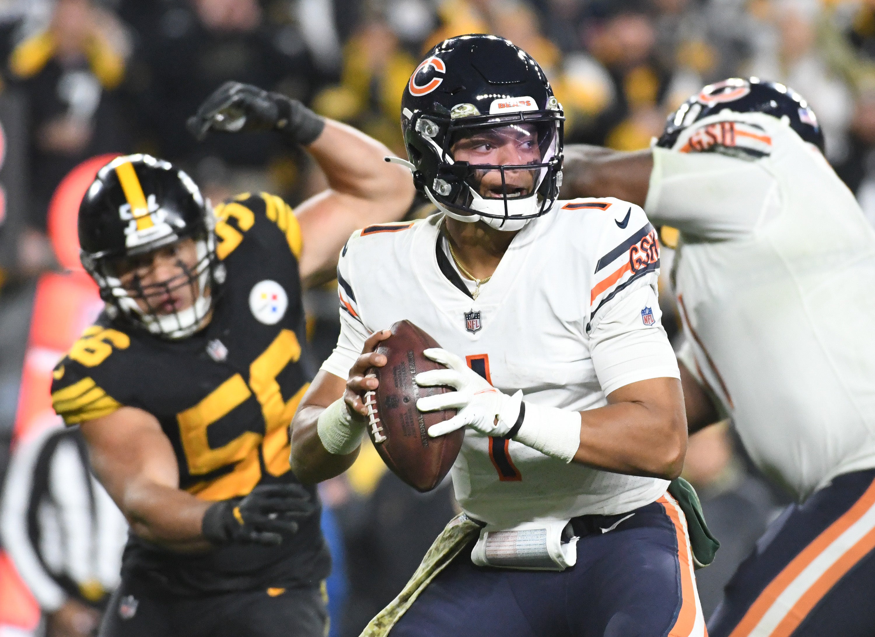 Nov 8, 2021; Pittsburgh, Pennsylvania, USA; Chicago Bears quarterback Justin Fields (1) throws a fourth quarter pass under pressure from Pittsburgh Steelers linebacker Alex Highsmith (56) at Heinz Field. The Steelers won 29-27. Mandatory Credit: Philip G. Pavely-USA TODAY Sports  