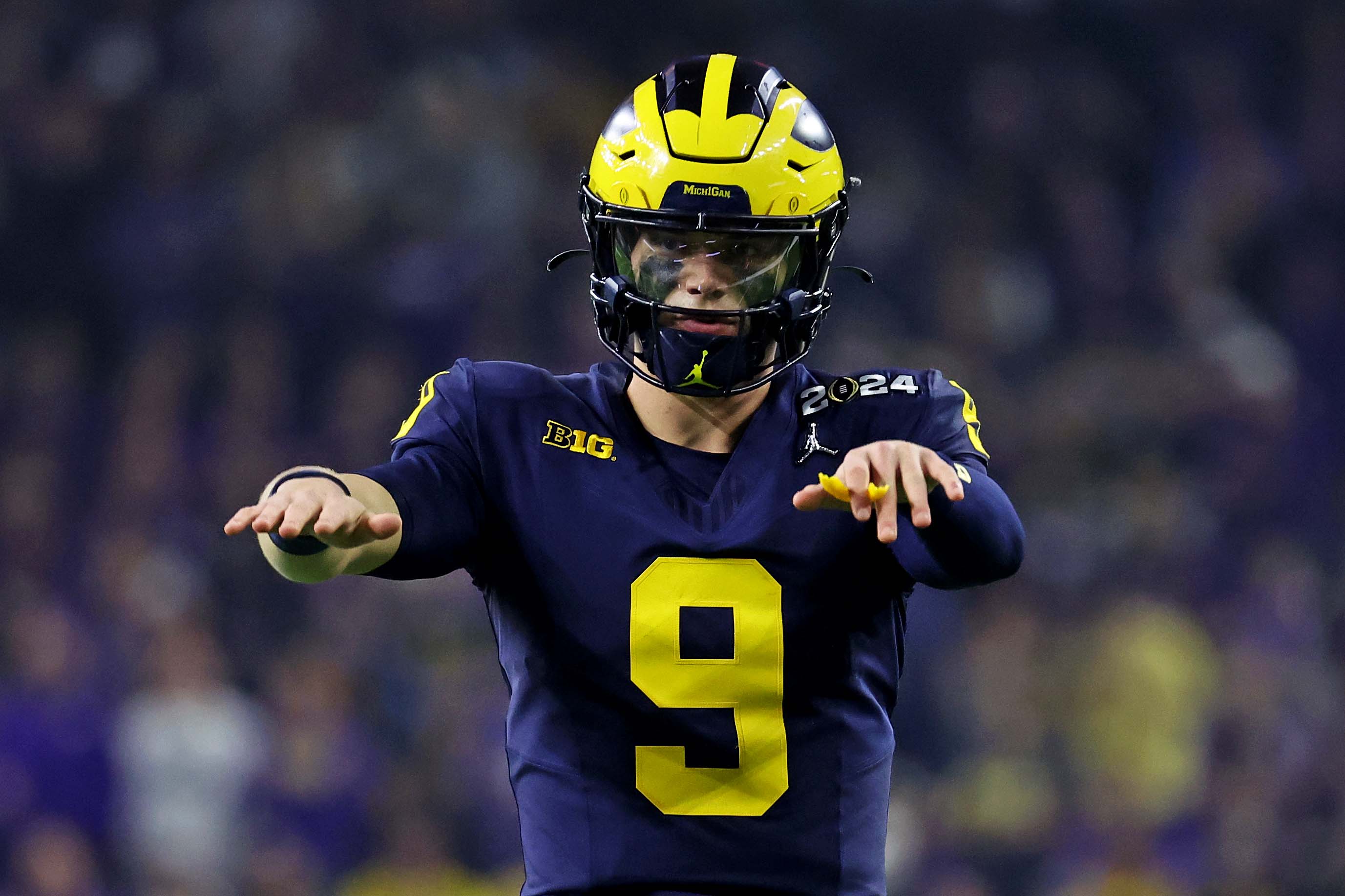 Jan 8, 2024; Houston, TX, USA; Michigan Wolverines quarterback J.J. McCarthy (9) reacts during the second quarter against the Washington Huskies in the 2024 College Football Playoff national championship game at NRG Stadium.