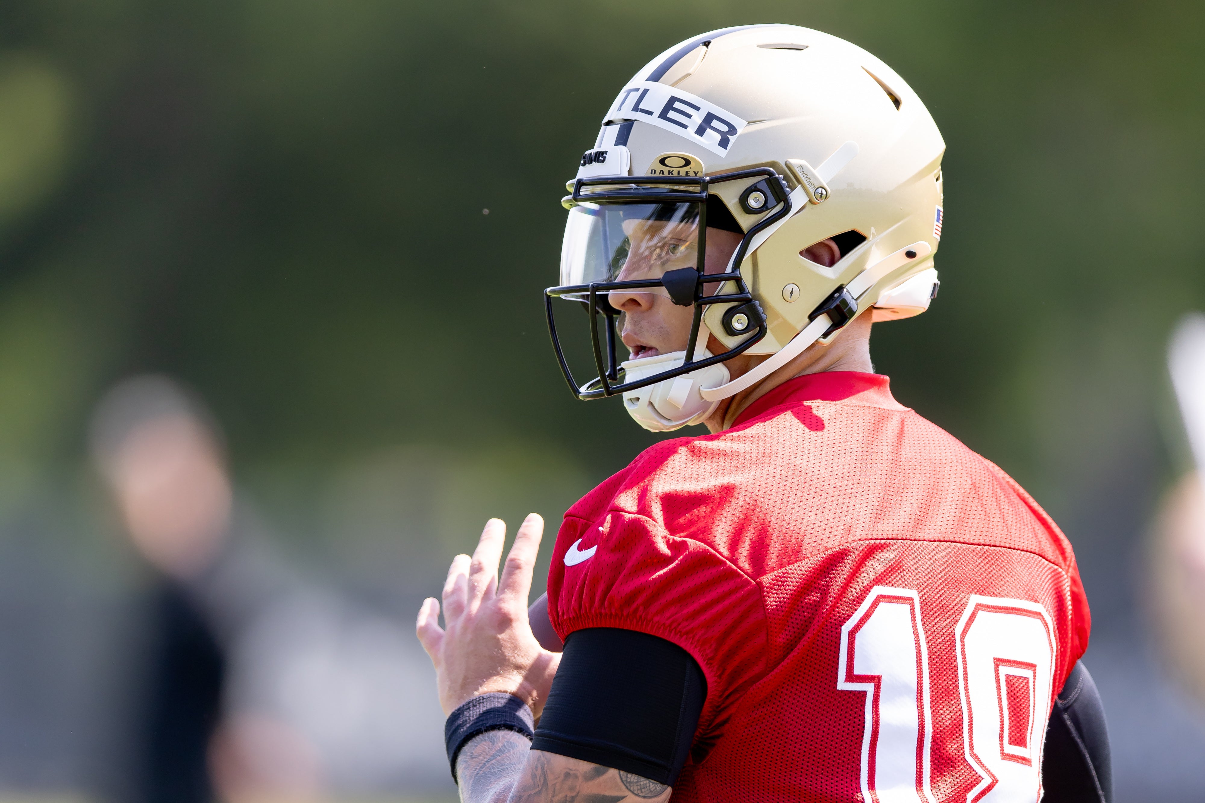 May 11, 2024; New Orleans, LA, USA; New Orleans Saints quarterback Spencer Rattler (18) runs quarterback drills during the rookie minicamp at the Ochsner Sports Performance Center.