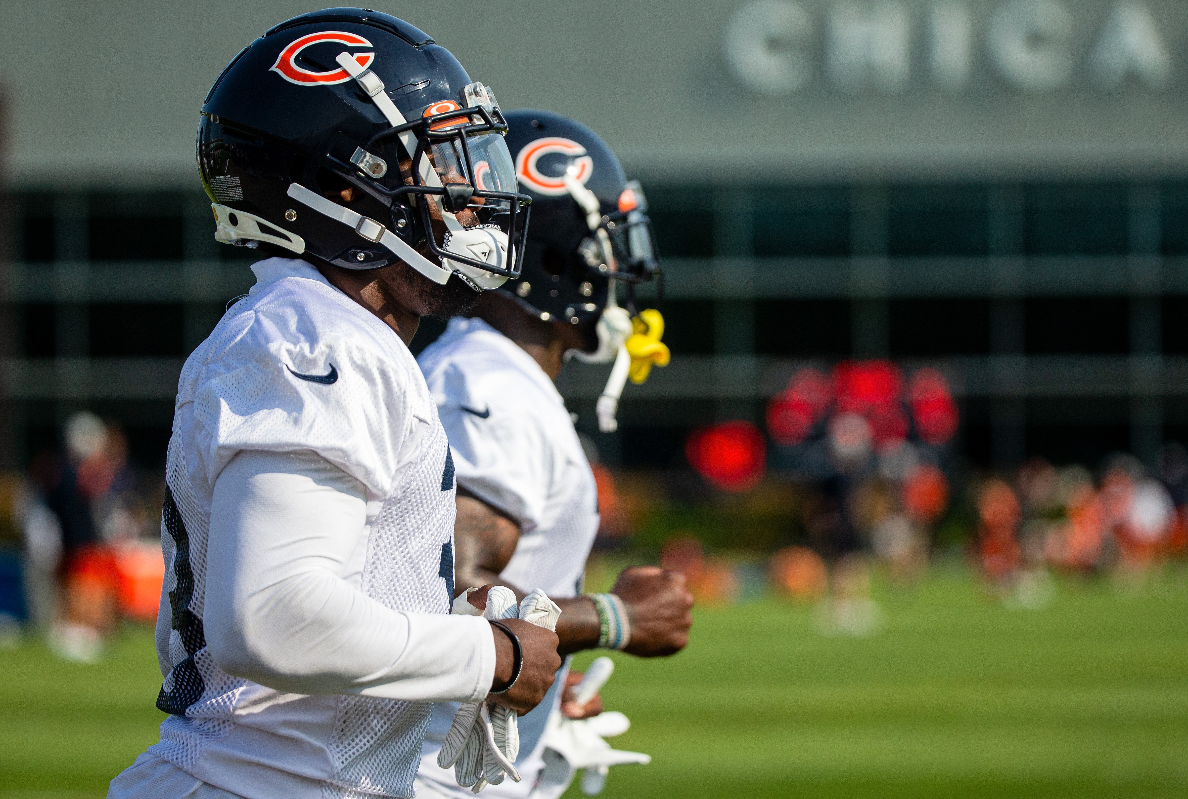 Jul 29, 2021; Lake Forest, IL, USA; Chicago Bears defensive back Jaylon Johnson (33) runs a lap around the field at the start of a Chicago Bears training camp session at Halas Hall.