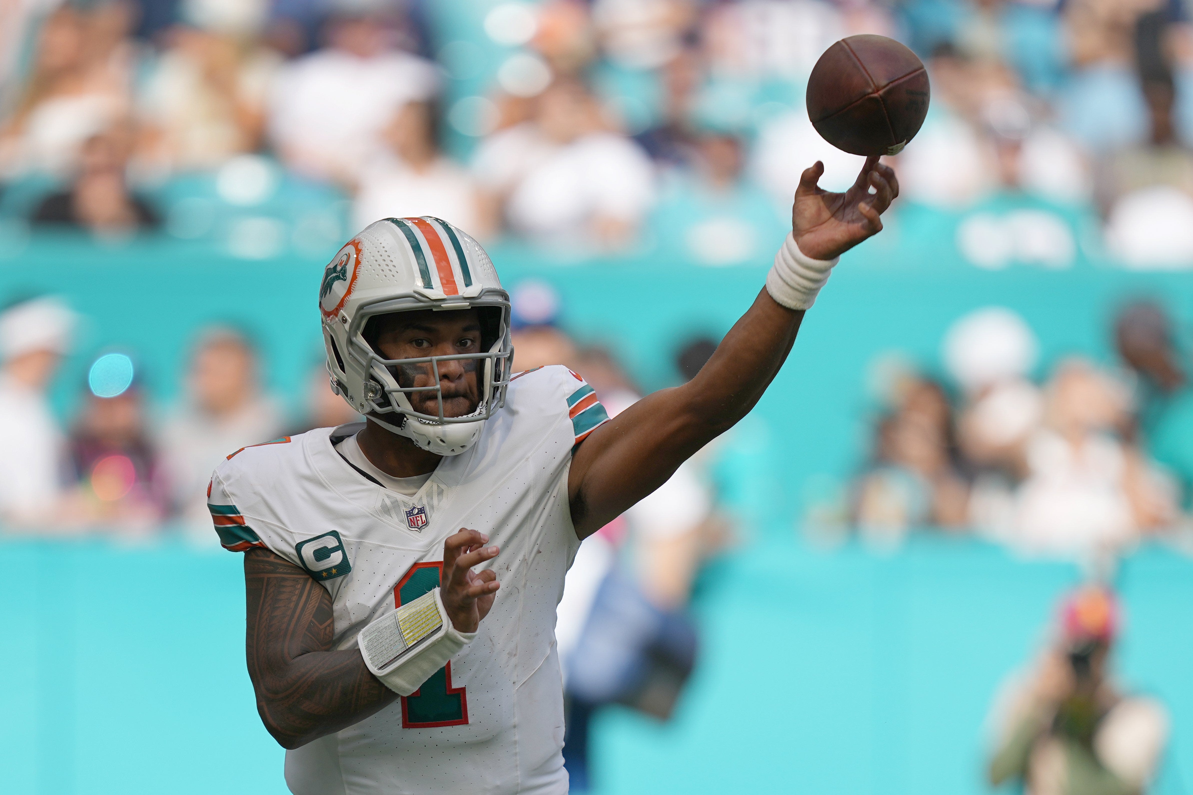 Miami Dolphins quarterback Tua Tagovailoa (1) drops back to pass against the New England Patriots during the second half of an NFL game at Hard Rock Stadium in Miami Gardens, Oct. 29, 2023.