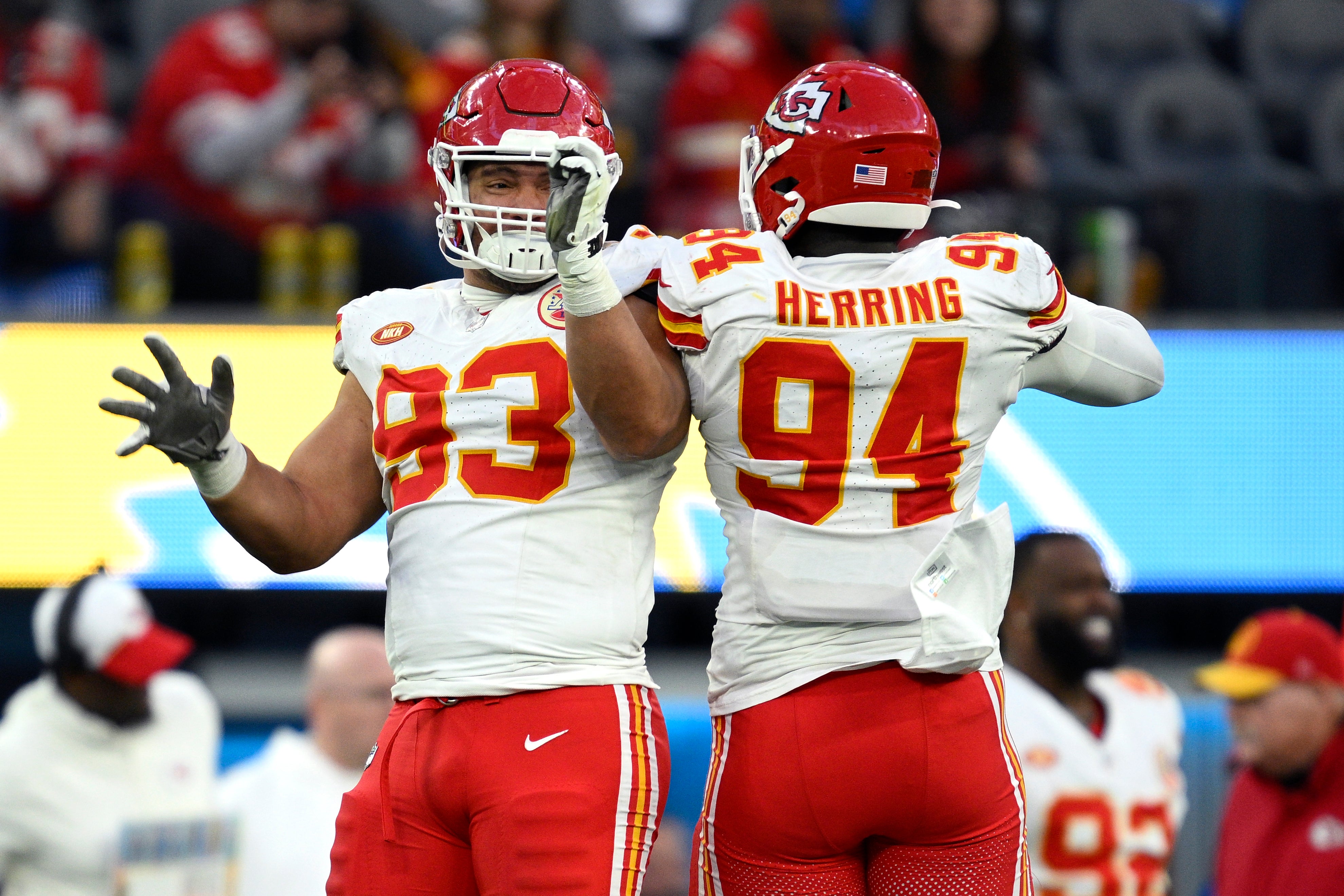 Jan 7, 2024; Inglewood, California, USA; Kansas City Chiefs defensive tackle Matt Dickerson (93) and defensive end Malik Herring (94) leap in celebration during the second half against the Los Angeles Chargers at SoFi Stadium.