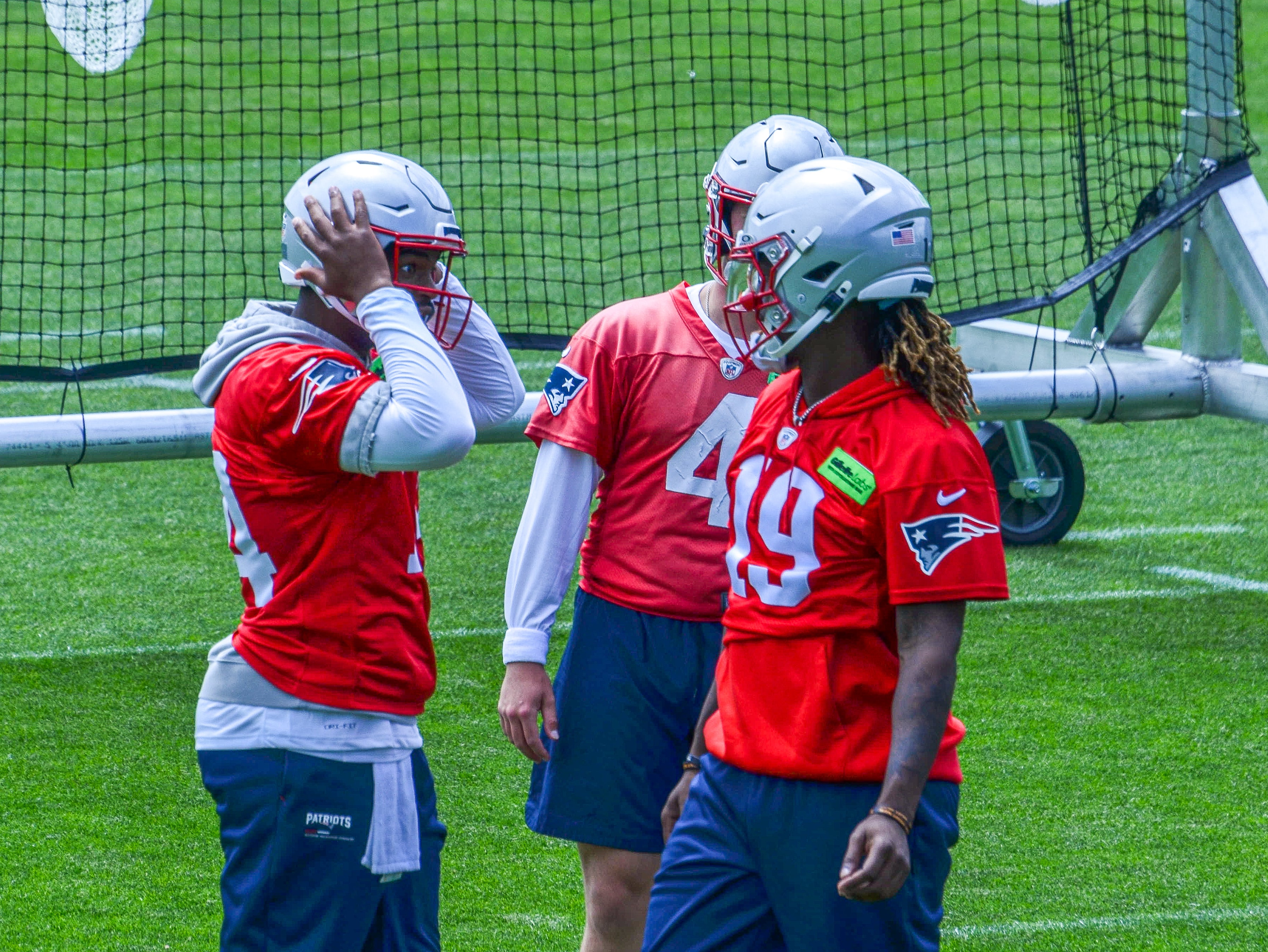 Monday, May 20 - QBs Jacoby Brissett, Bailey Zappe, and Joe Milton talk during OTAs