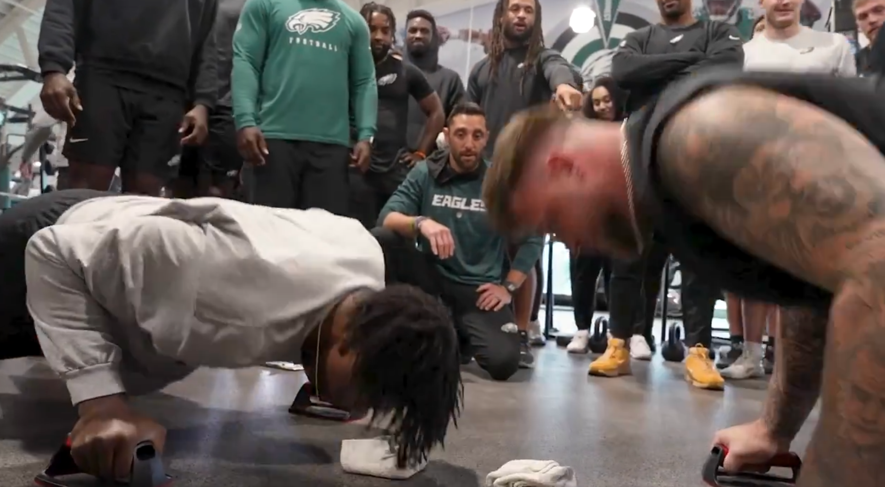 Philadelphia Eagles rookies Gabe Hall and Trevor Keegan show off strength in push-up competition.