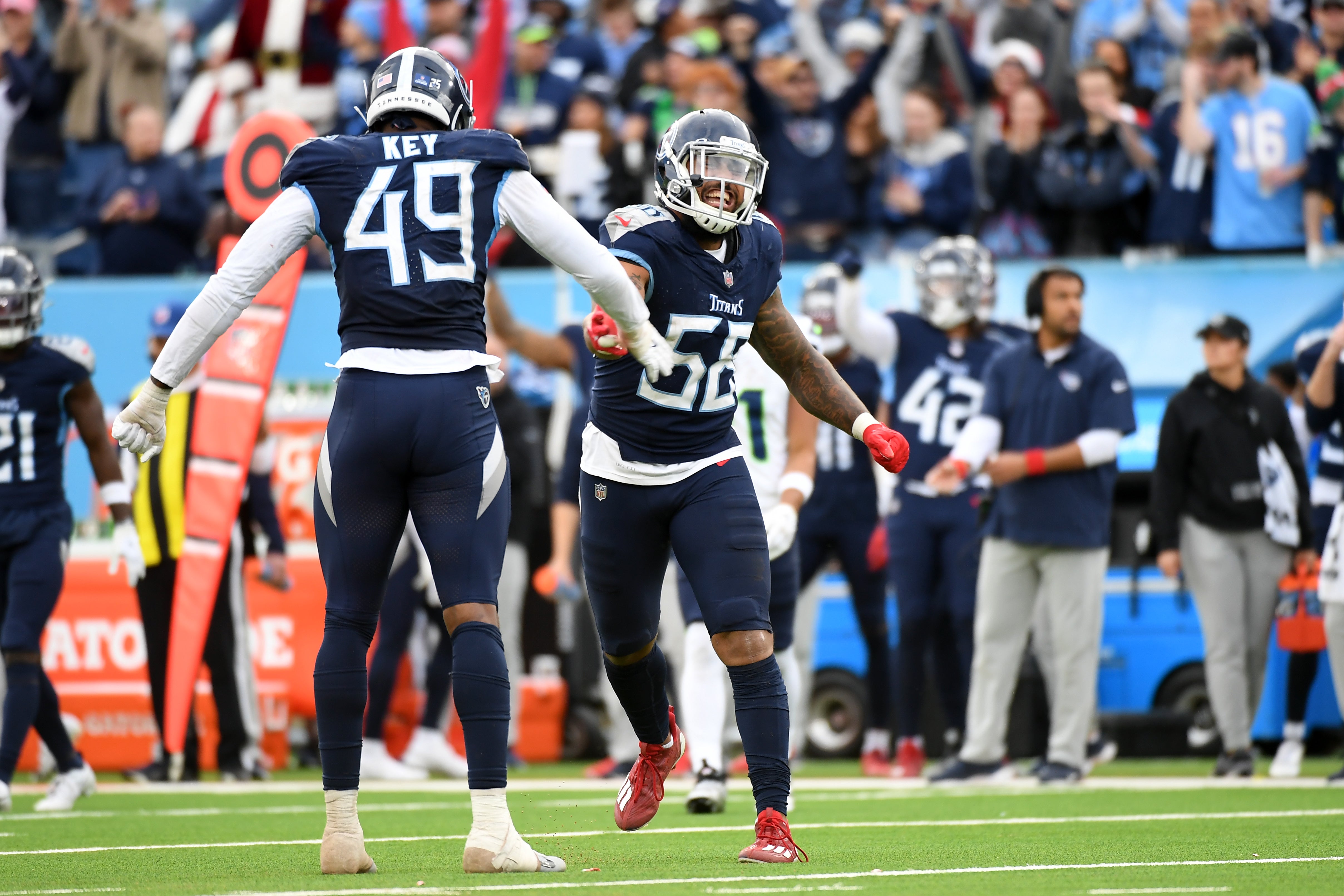 Dec 24, 2023; Nashville, Tennessee, USA; Tennessee Titans linebacker Harold Landry III (58) and linebacker Arden Key (49) celebrate after a sack during the second half against the Seattle Seahawks at Nissan Stadium.