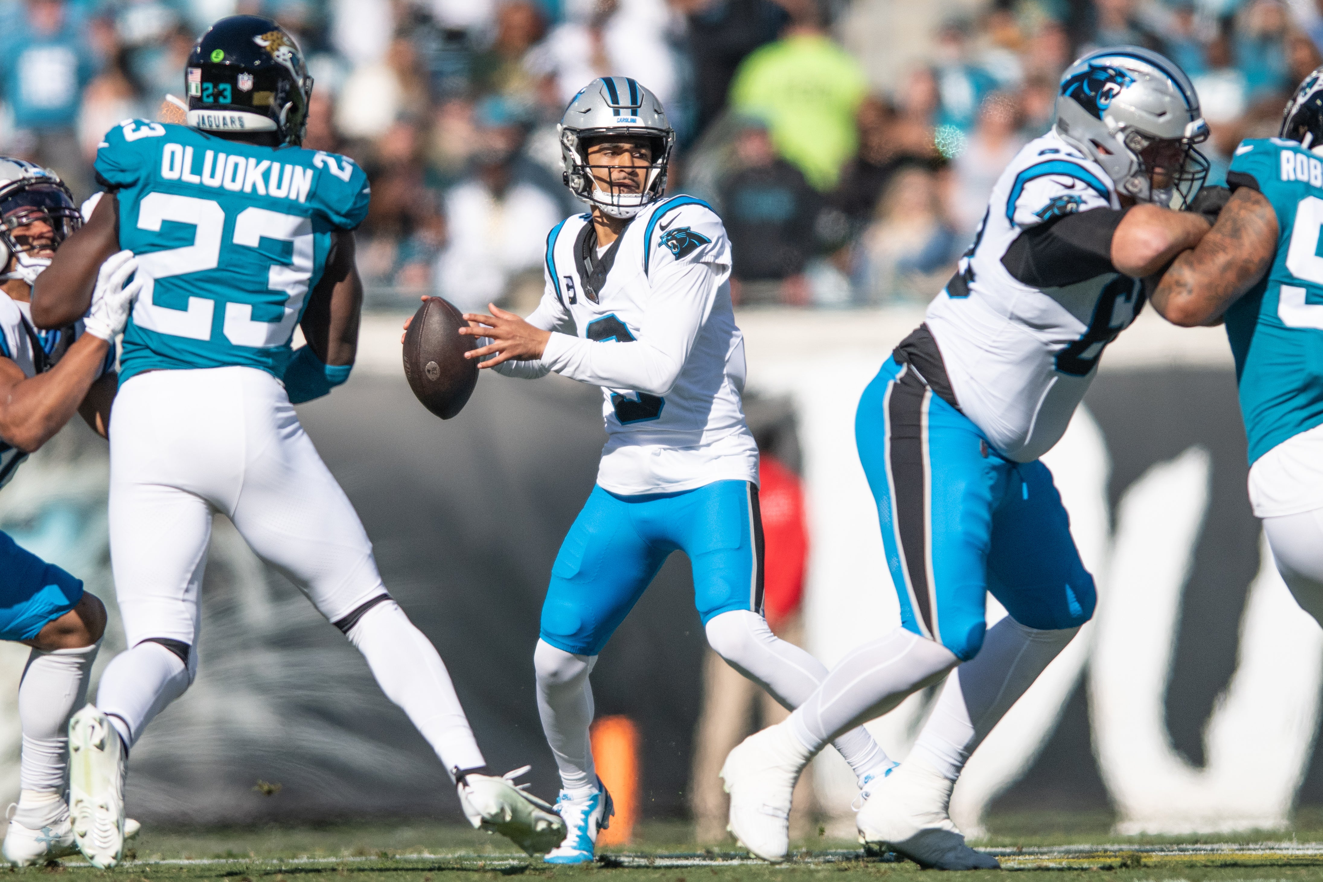 Dec 31, 2023; Jacksonville, Florida, USA; Carolina Panthers quarterback Bryce Young (9) gets ready to throw the ball against the Jacksonville Jaguars in the first quarter at EverBank Stadium. Mandatory Credit: Jeremy Reper-USA TODAY Sports