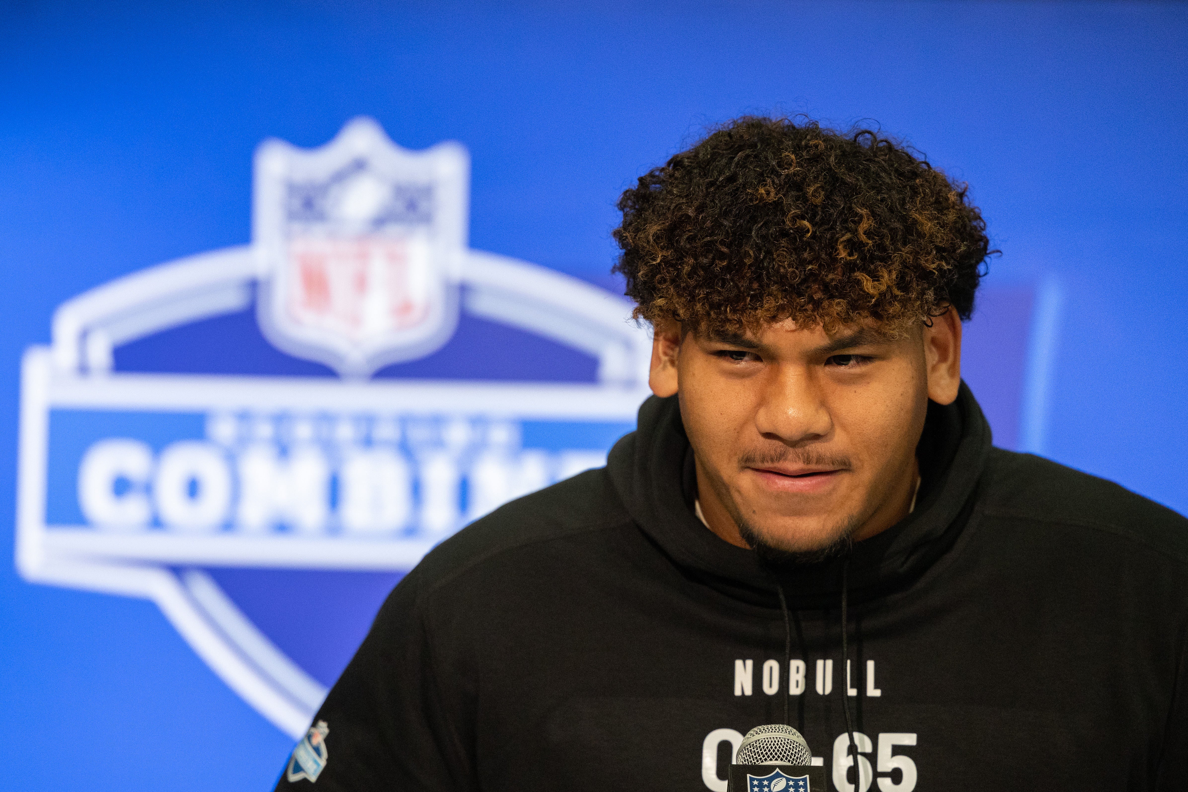 Mar 2, 2024; Indianapolis, IN, USA; Brigham Young offensive lineman Kingsley Suamataia (OL65) talks to the media during the 2024 NFL Combine at Lucas Oil Stadium.