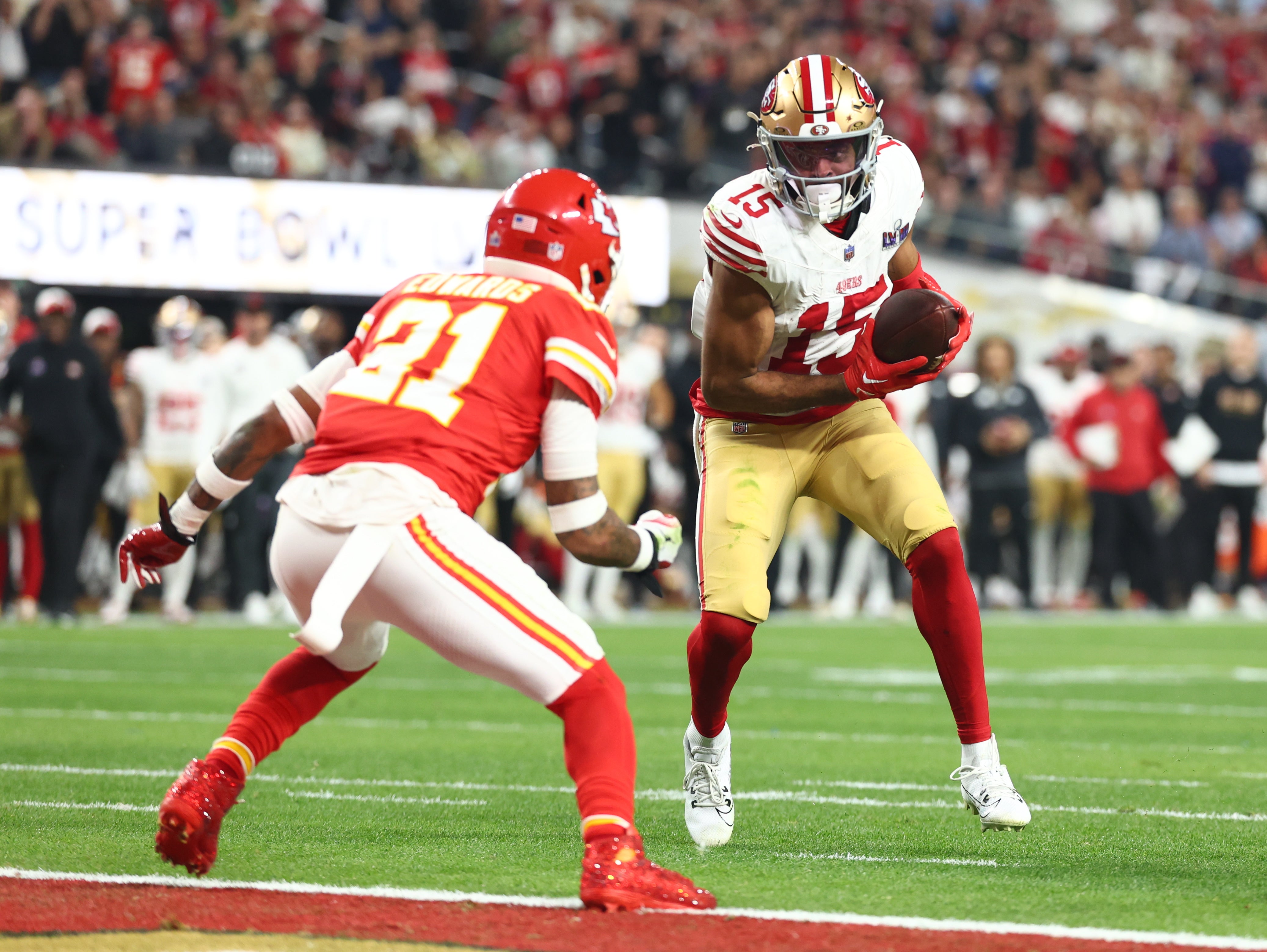 Feb 11, 2024; Paradise, Nevada, USA; San Francisco 49ers wide receiver Jauan Jennings (15) scores a touchdown against Kansas City Chiefs safety Mike Edwards (21) in the second half in Super Bowl LVIII at Allegiant Stadium.