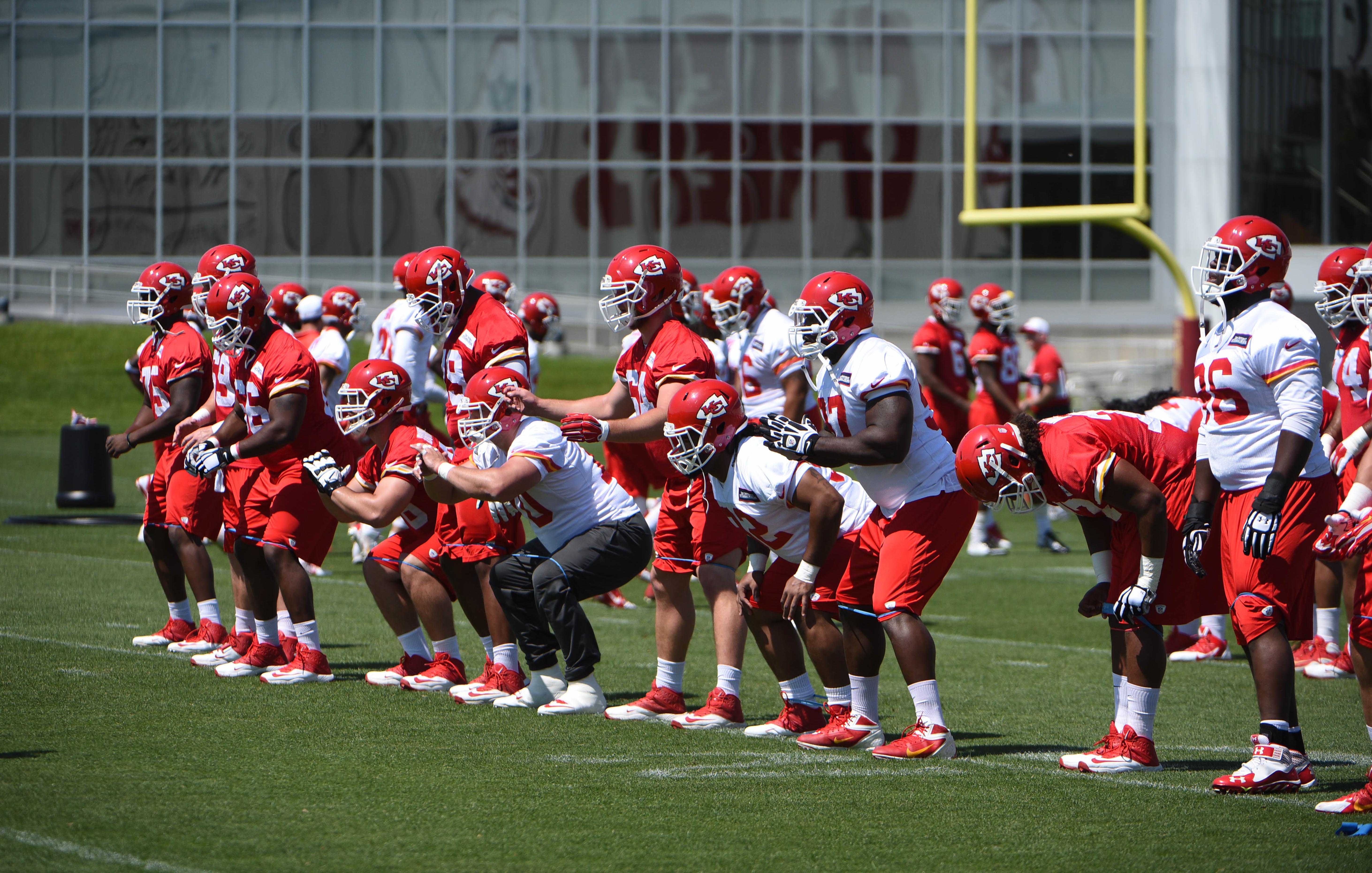 May 27, 2015; Kansas City, MO, USA; Kansas City Chiefs players run drills during organized team activities at the University of Kansas Hospital Training Complex.
