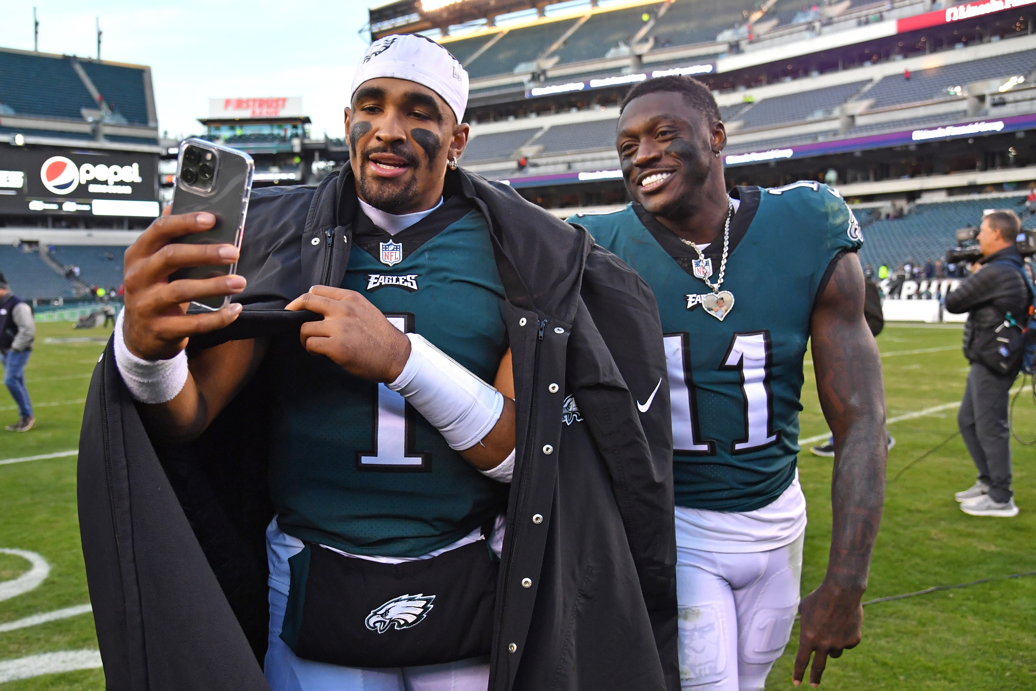 Philadelphia Eagles quarterback Jalen Hurts (1) and wide receiver A.J. Brown (11) walks off the field after win against the Tennessee Titans at Lincoln Financial Field.