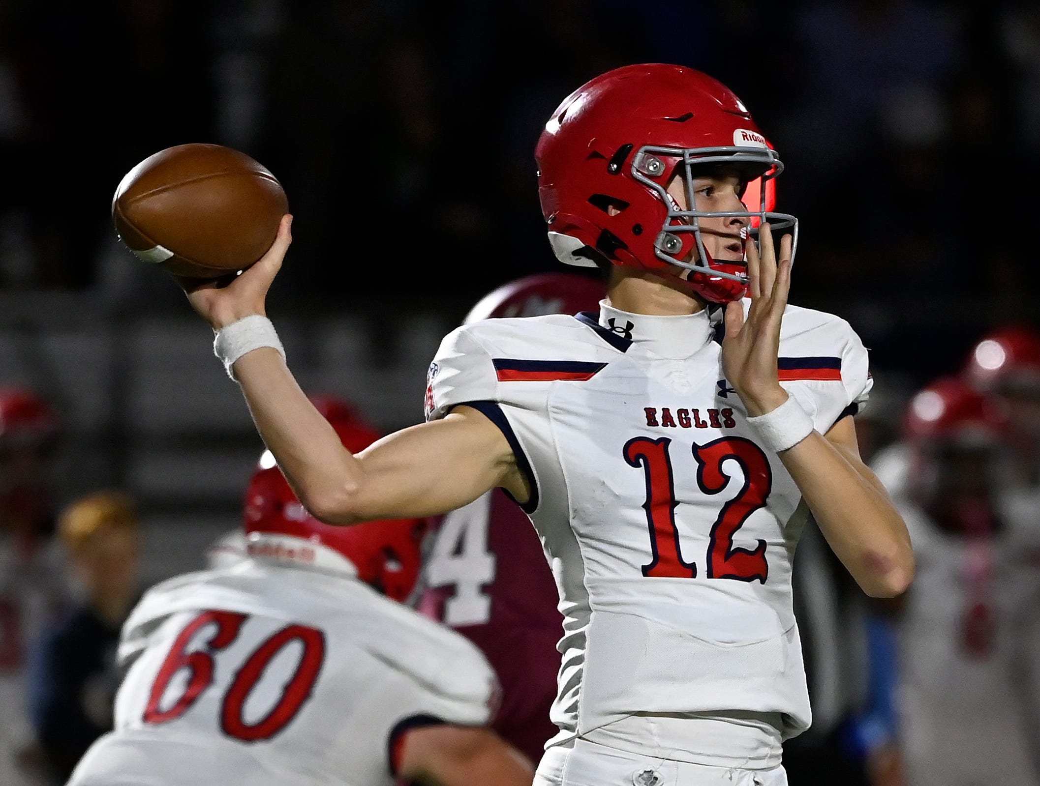 Brentwood Academy George MacIntyre (12) passes against MBA during an high school football game Thursday, Oct. 26, 2023, in Nashville, Tenn.