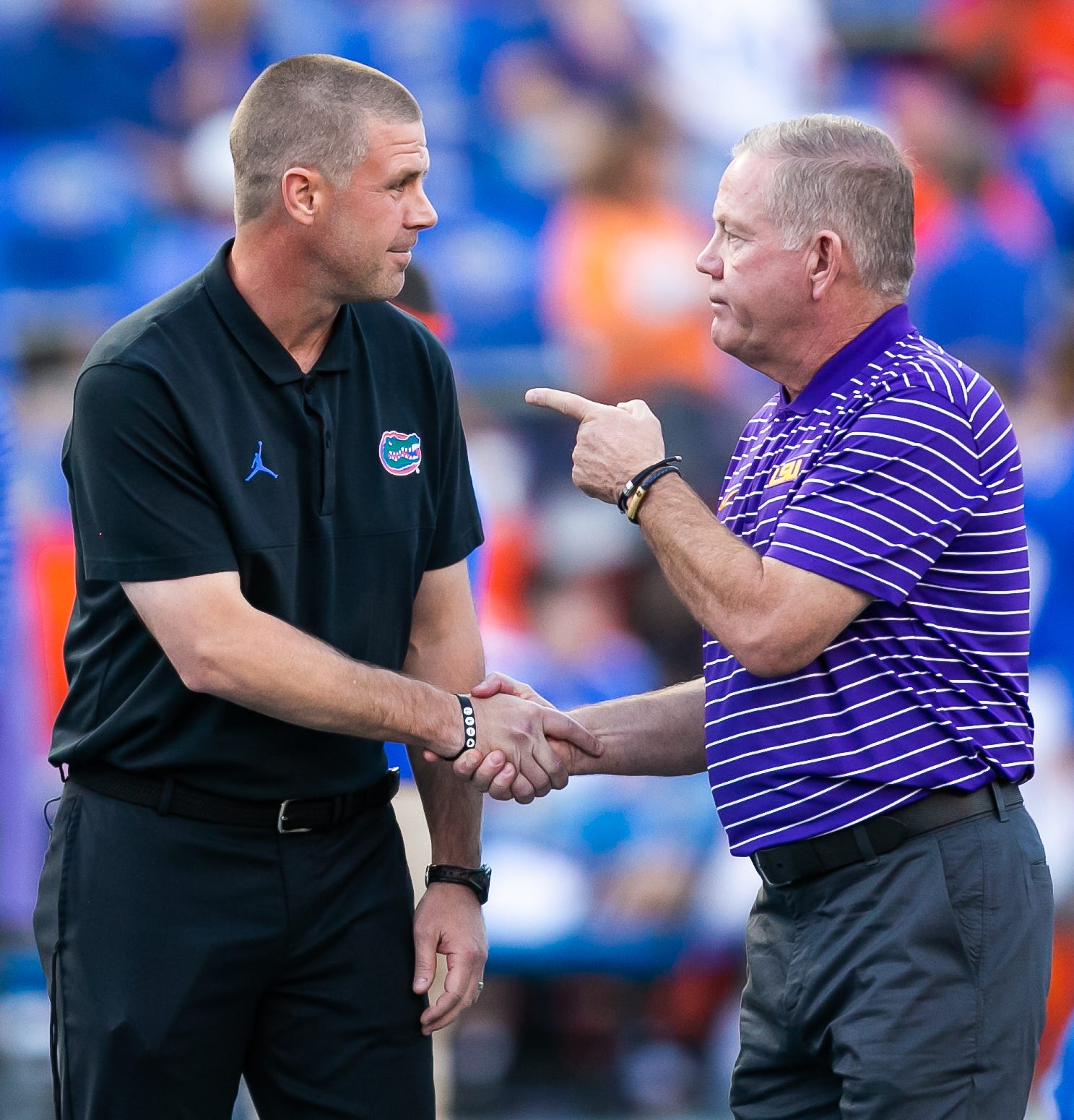 Florida Gators head coach Billy Napier, left and LSU Tigers head coach Brian Kelly talk at Steve Spurrier Field at Ben Hill Griffin Stadium in Gainesville, FL on Saturday, October 15, 2022 before the start of the game. [Doug Engle/Gainesville Sun]