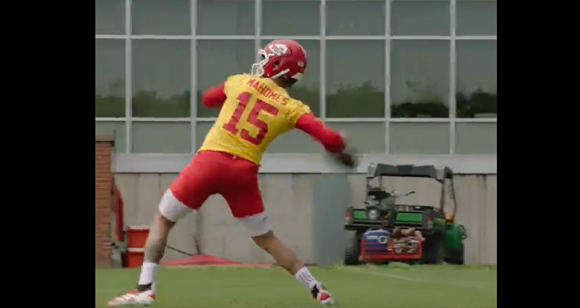 Chiefs QB Patrick Mahomes loads to throw at OTAs.
