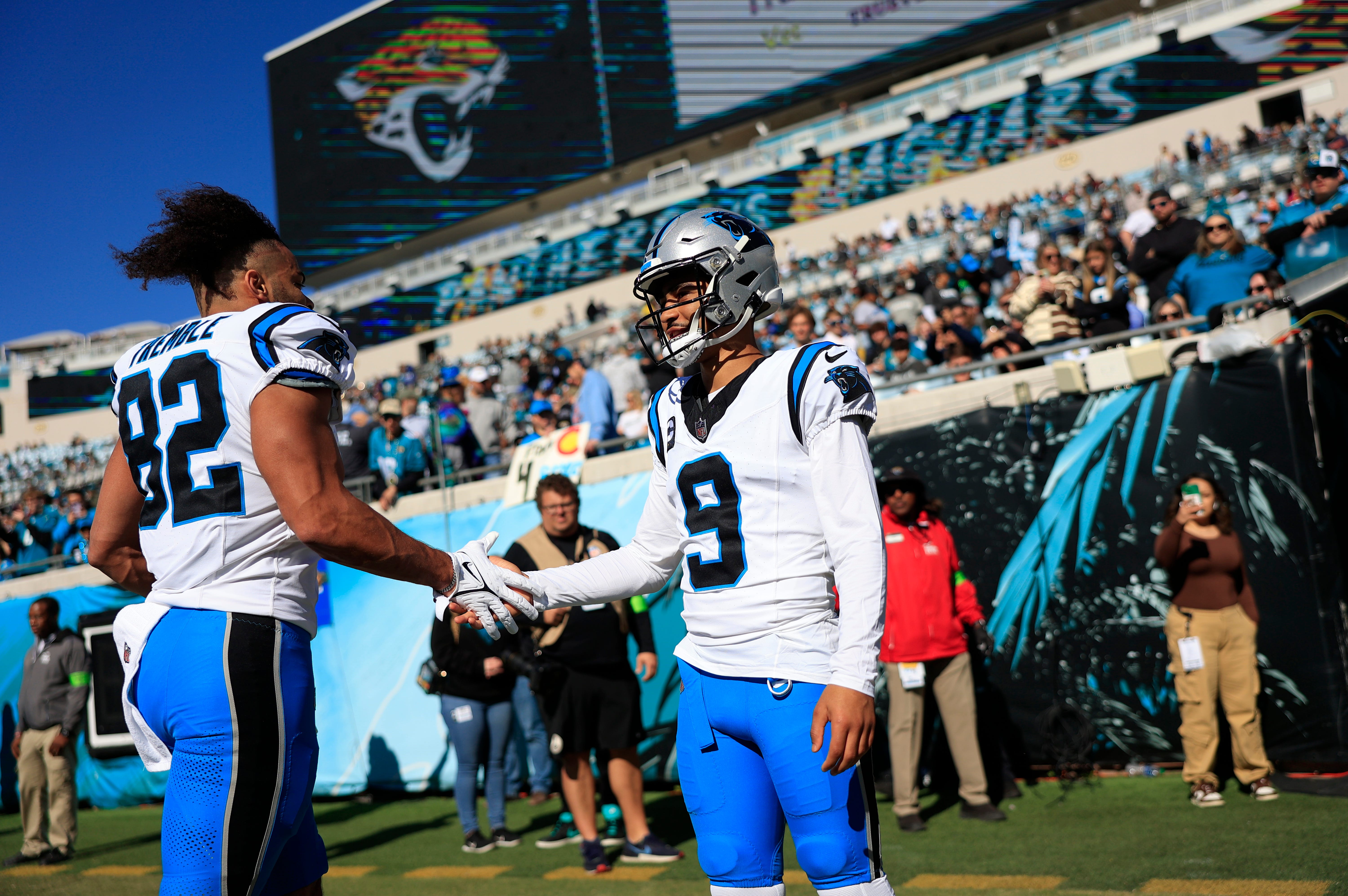 Carolina Panthers quarterback Bryce Young (9) greets tight end Tommy Tremble (82) before a regular season NFL football matchup Sunday, Dec. 31, 2023 at EverBank Stadium in Jacksonville, Fla. The Jacksonville Jaguars blanked the Carolina Panthers 26-0. [Corey Perrine/Florida Times-Union]