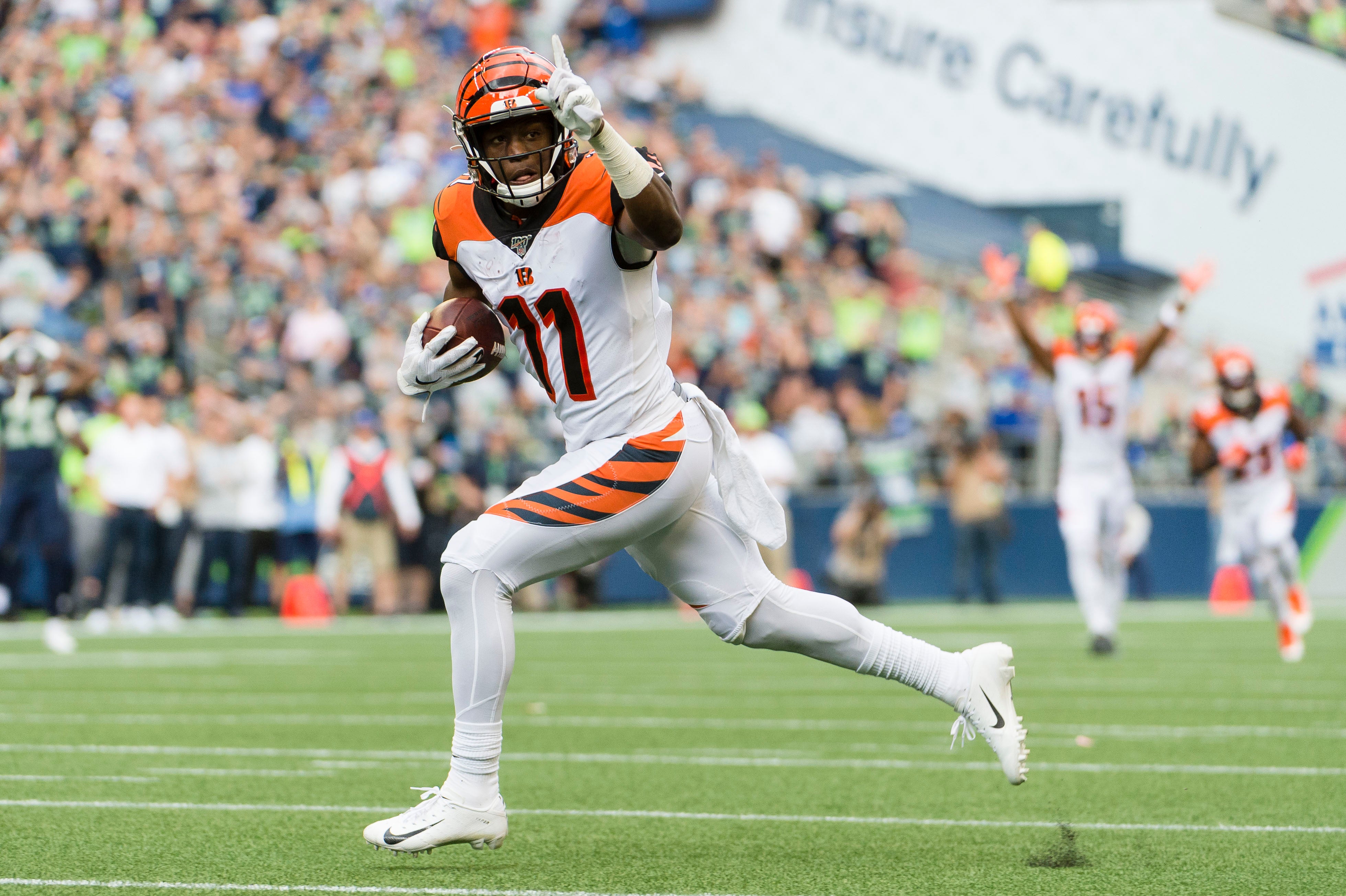 Cincinnati Bengals wide receiver John Ross (11) catches a touchdown pass during the first half against the Seattle Seahawks at CenturyLink Field.