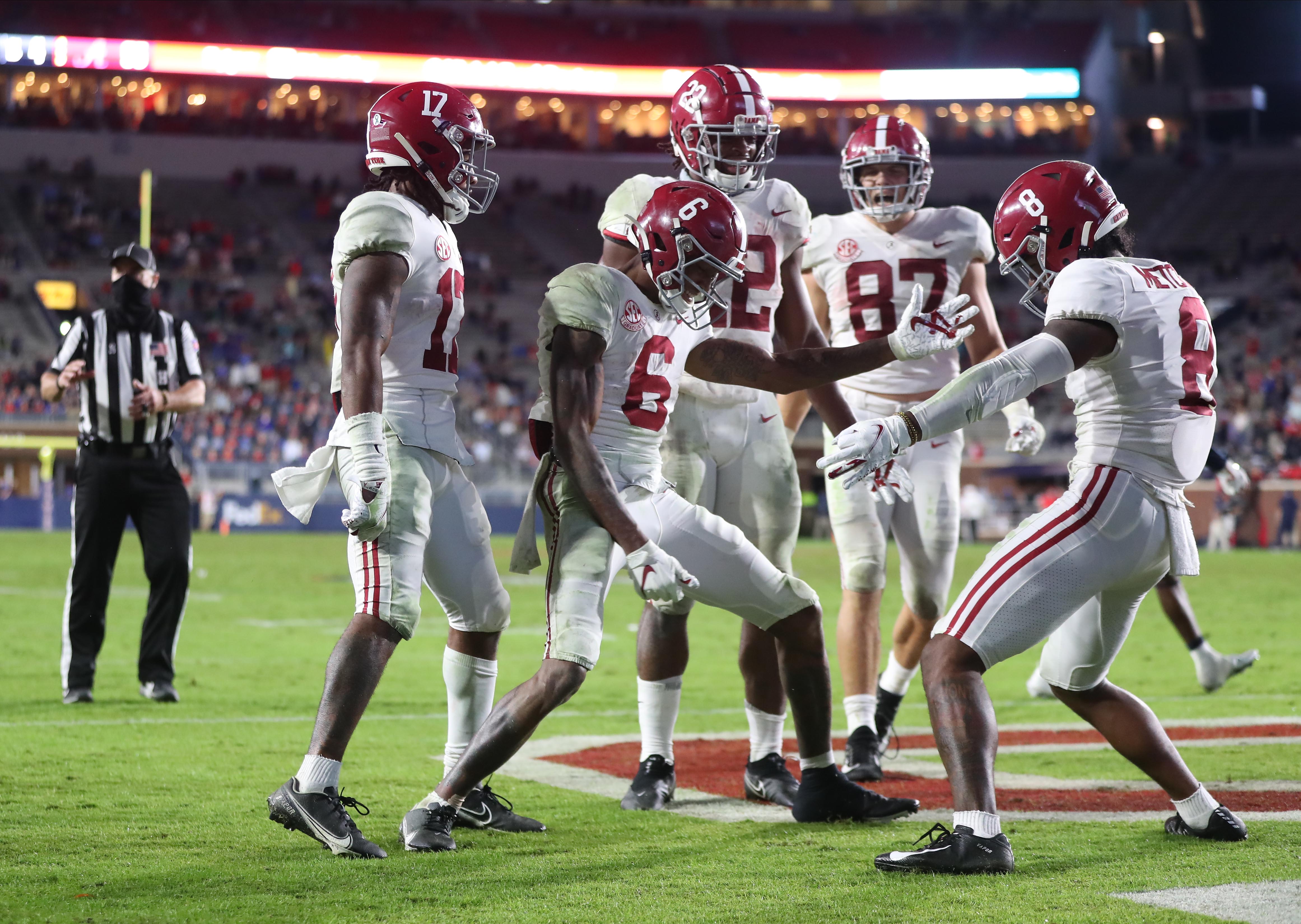 Oct 10, 2020; Oxford, MX, USA; Alabama receivers Jaylen Waddle (17), DeVonta Smith (6) and John Metchie III (8) celebrate during the game against Mississippi at Vaught-Hemingway Stadium. Mandatory Credit: Kent Gidley via USA TODAY Sports