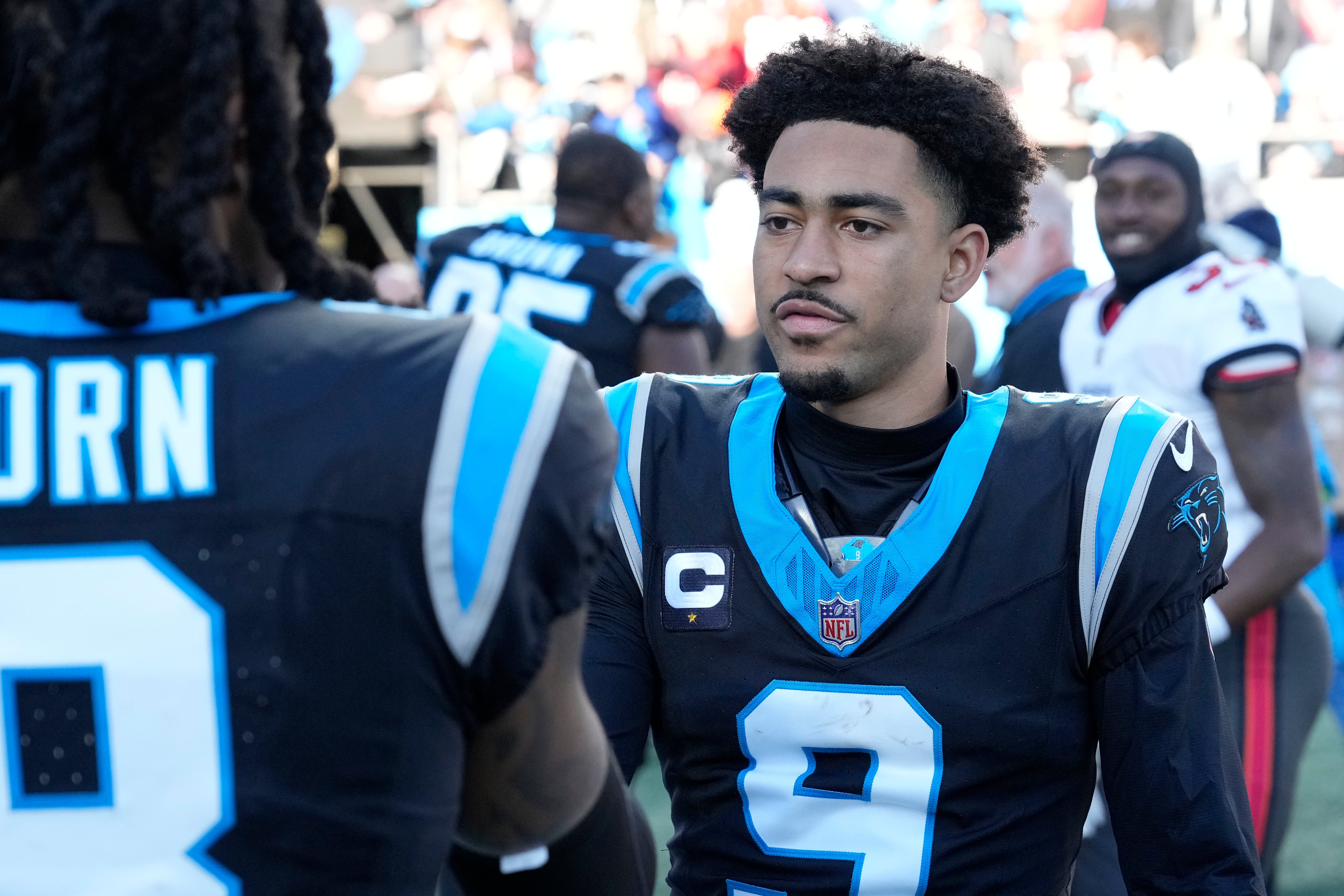 Jan 7, 2024; Charlotte, North Carolina, USA; Carolina Panthers quarterback Bryce Young (9) with cornerback Jaycee Horn (8) after the game at Bank of America Stadium. Mandatory Credit: Bob Donnan-USA TODAY Sports