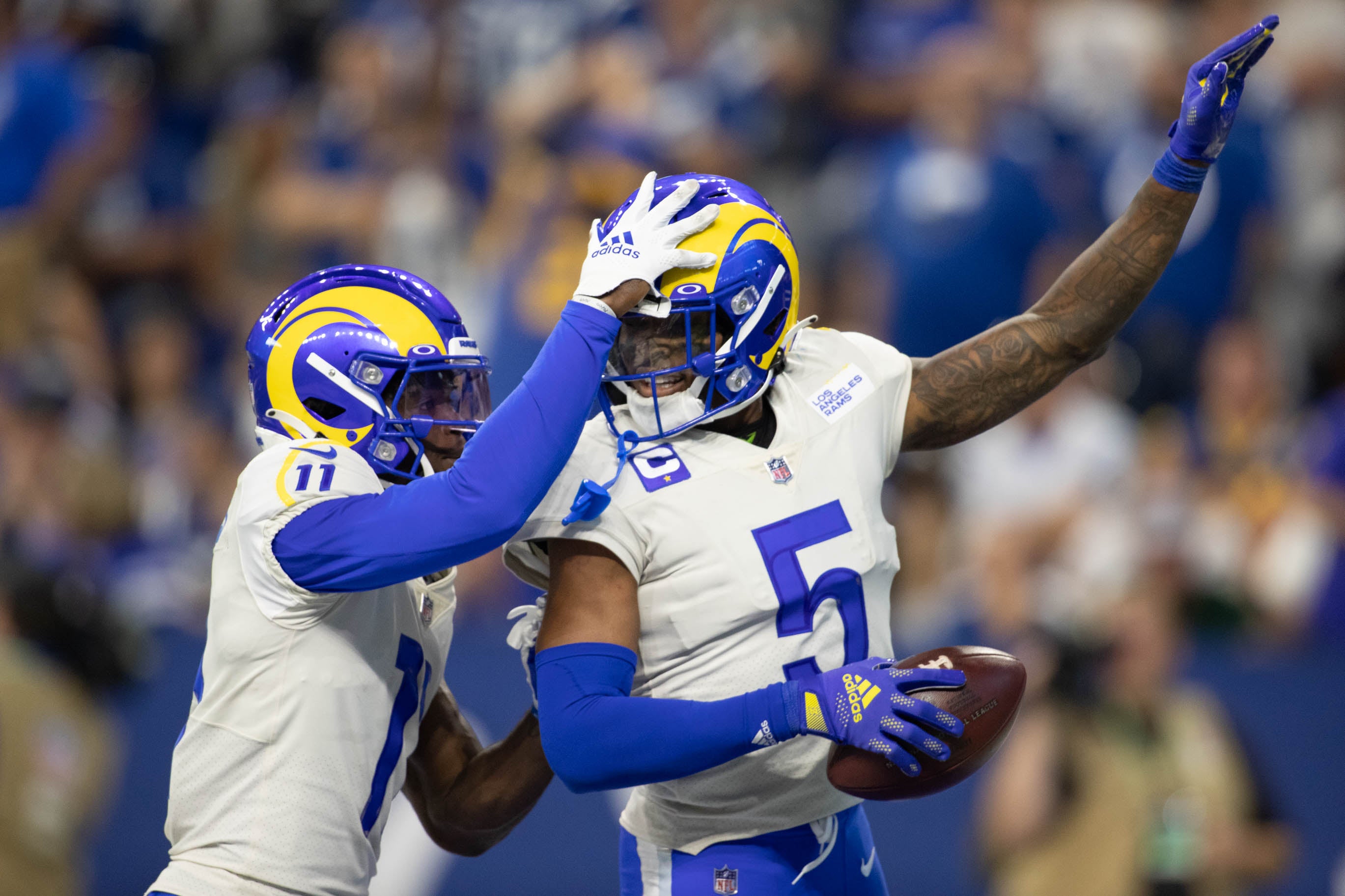 Sep 19, 2021; Indianapolis, Indiana, USA; Los Angeles Rams cornerback Jalen Ramsey (5) celebrates his interception with Rams defensive back Darious Williams (11) in the second half against the Indianapolis Colts at Lucas Oil Stadium. Mandatory Credit: Trevor Ruszkowski-USA TODAY Sports