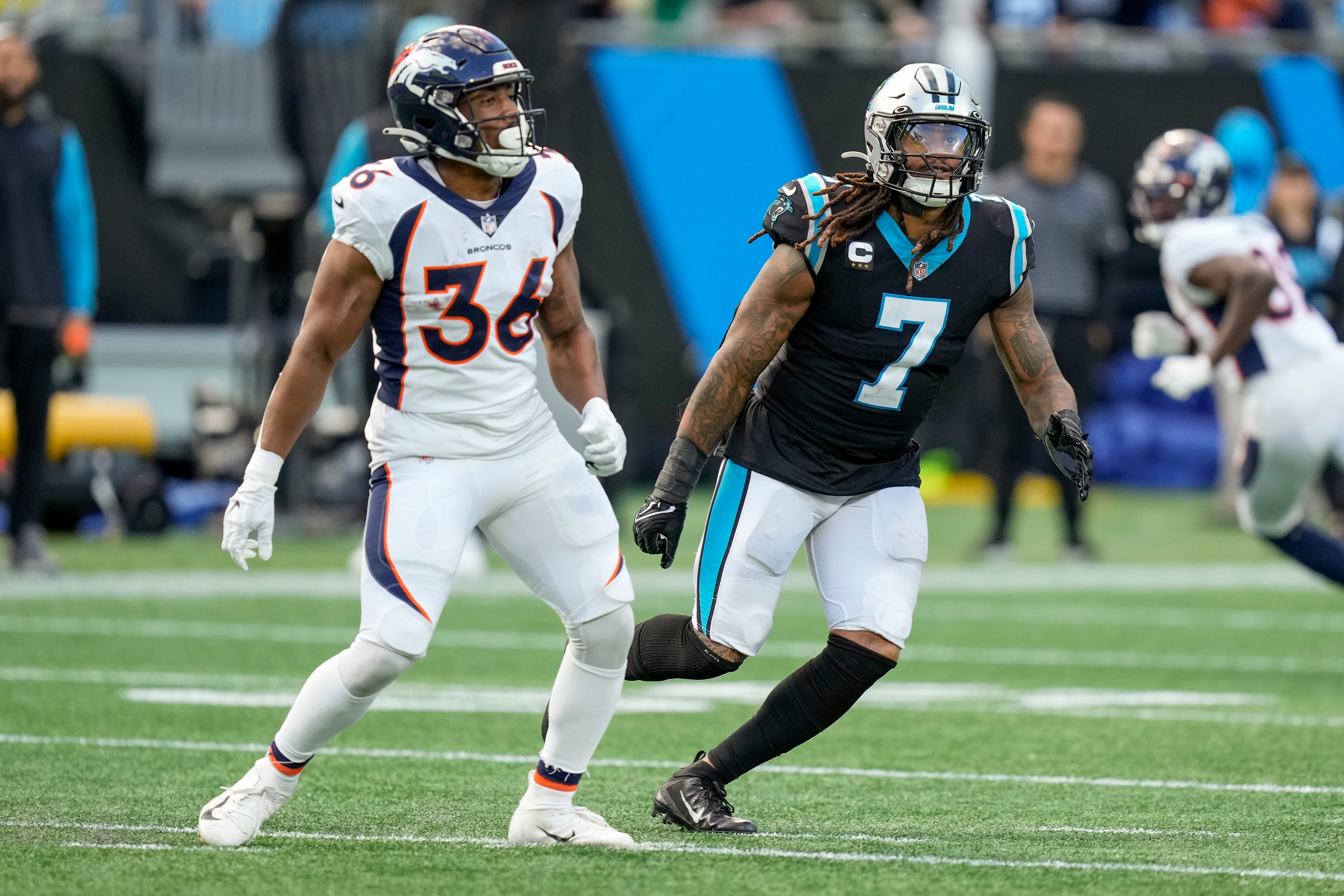 Nov 27, 2022; Charlotte, North Carolina, USA; Carolina Panthers linebacker Shaq Thompson (7) drops back in coverage of Denver Broncos running back Devine Ozigbo (36) during the second half at Bank of America Stadium. Mandatory Credit: Jim Dedmon-USA TODAY Sports