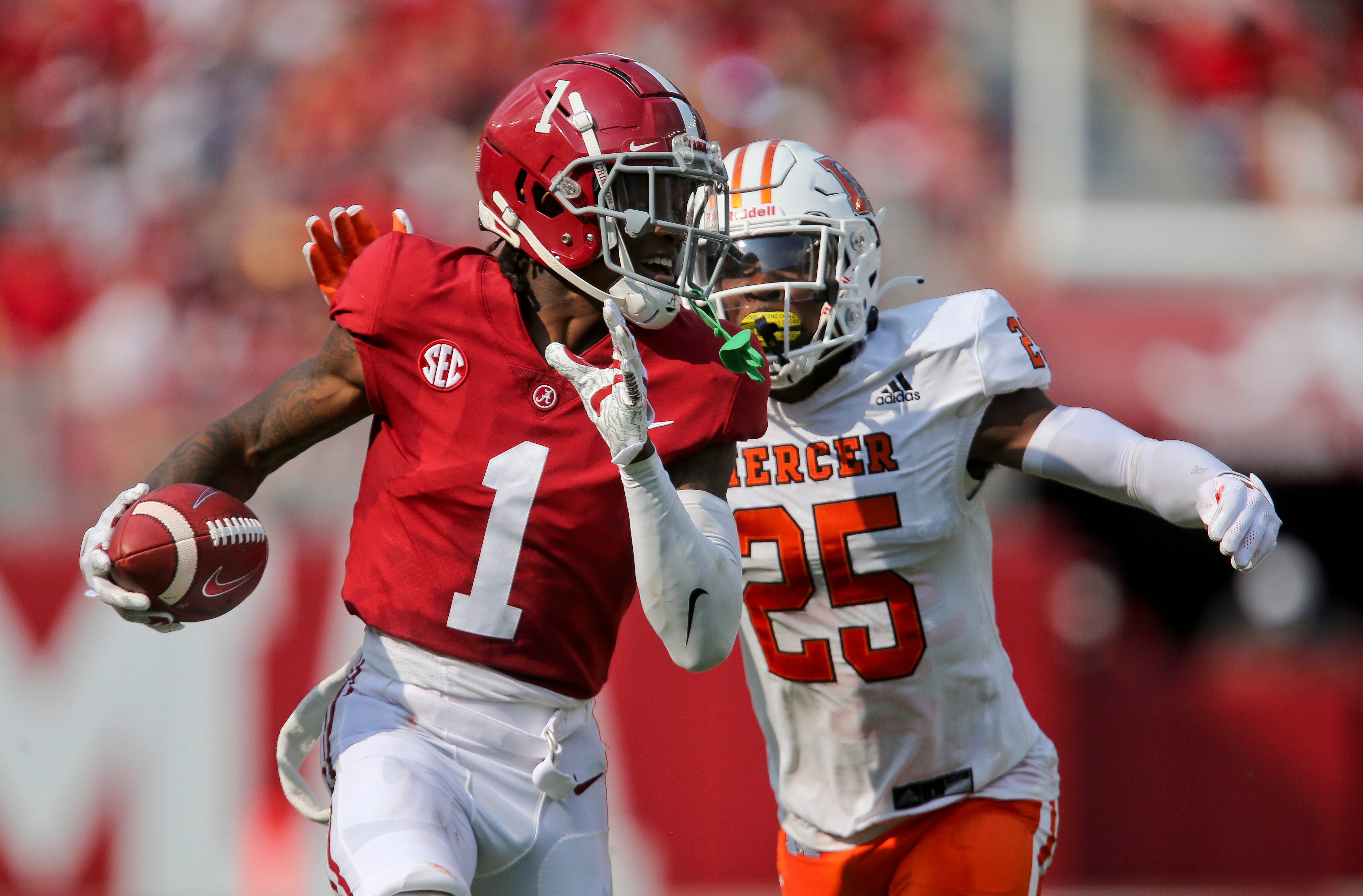 Alabama wide receiver Jameson Williams (1) runs away from Mercer cornerback TJ Moore (25) after catching a pass Saturday, Sept. 11, 2021, in Bryant-Denny Stadium. The gain was negated by a penalty. [Staff Photo/Gary Cosby Jr.] Alabama Vs Mercer