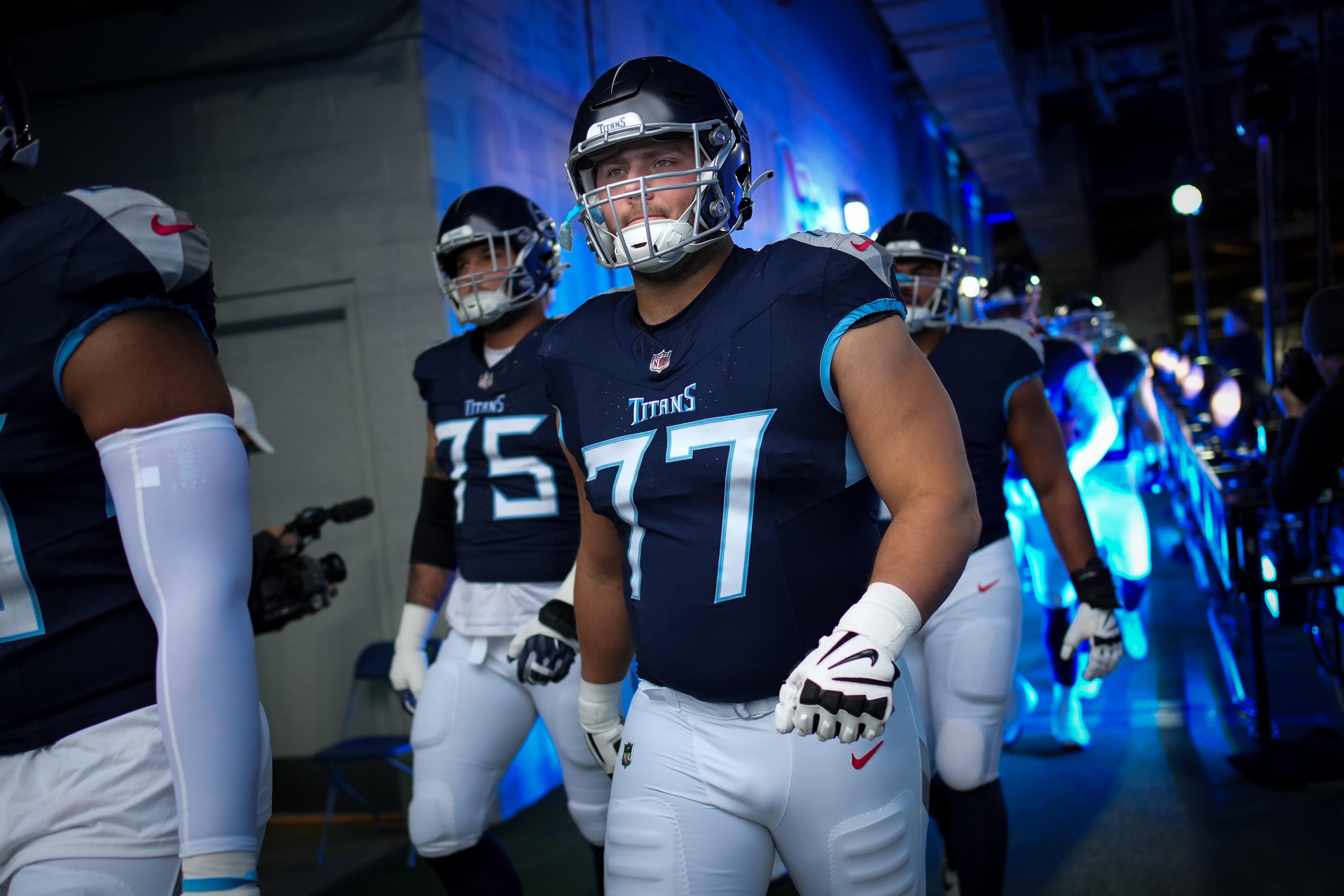 Tennessee Titans offensive tackle Peter Skoronski (77) heads out for warm ups before a game against the Carolina Panthers at Nissan Stadium in Nashville, Tenn., Sunday, Nov. 26, 2023.