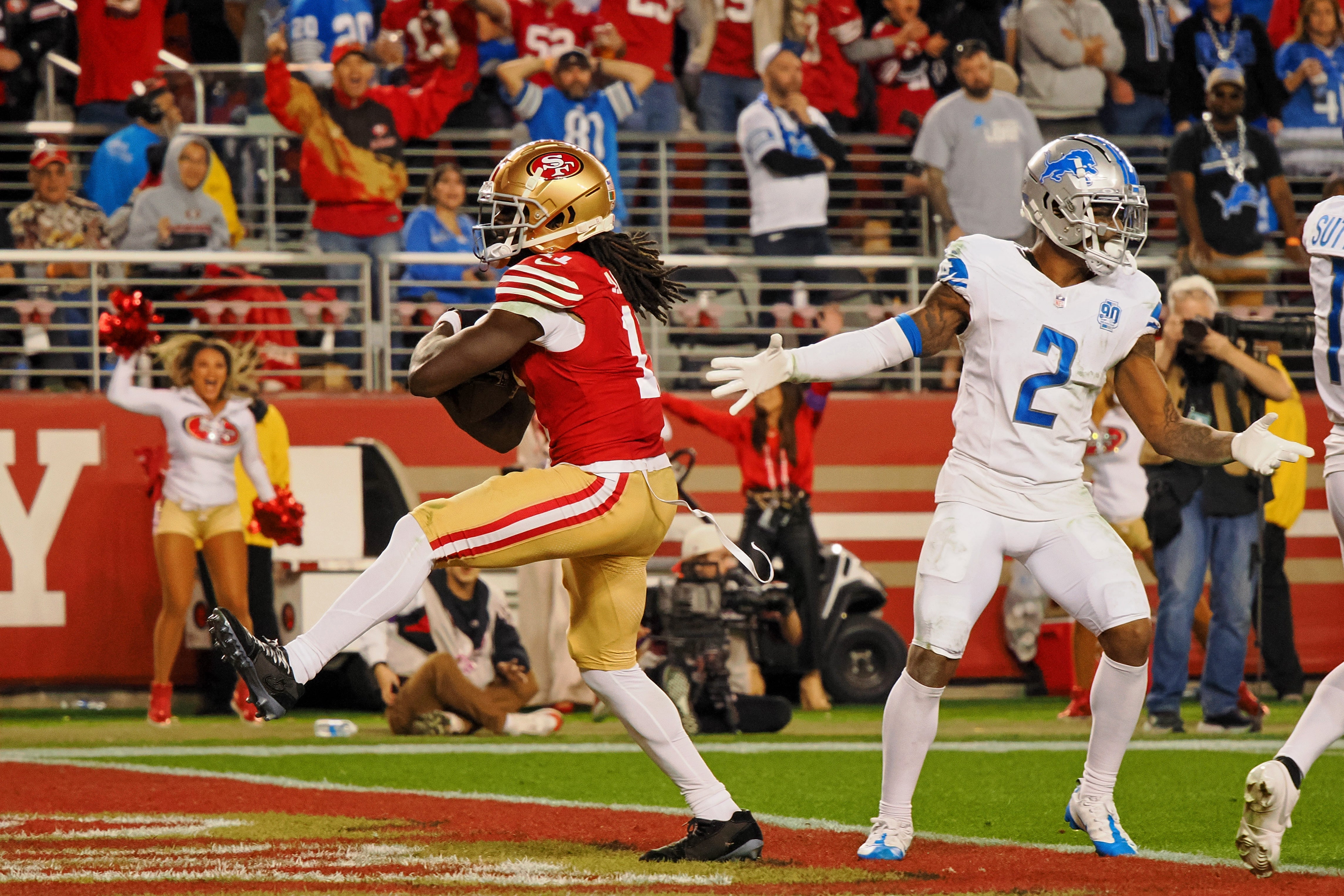 Jan 28, 2024; Santa Clara, California, USA; San Francisco 49ers wide receiver Brandon Aiyuk (11) reacts after catching a ball that bounced off the face mask of Detroit Lions cornerback Kindle Vildor (not pictured) during the second half of the NFC Championship football game at Levi's Stadium.