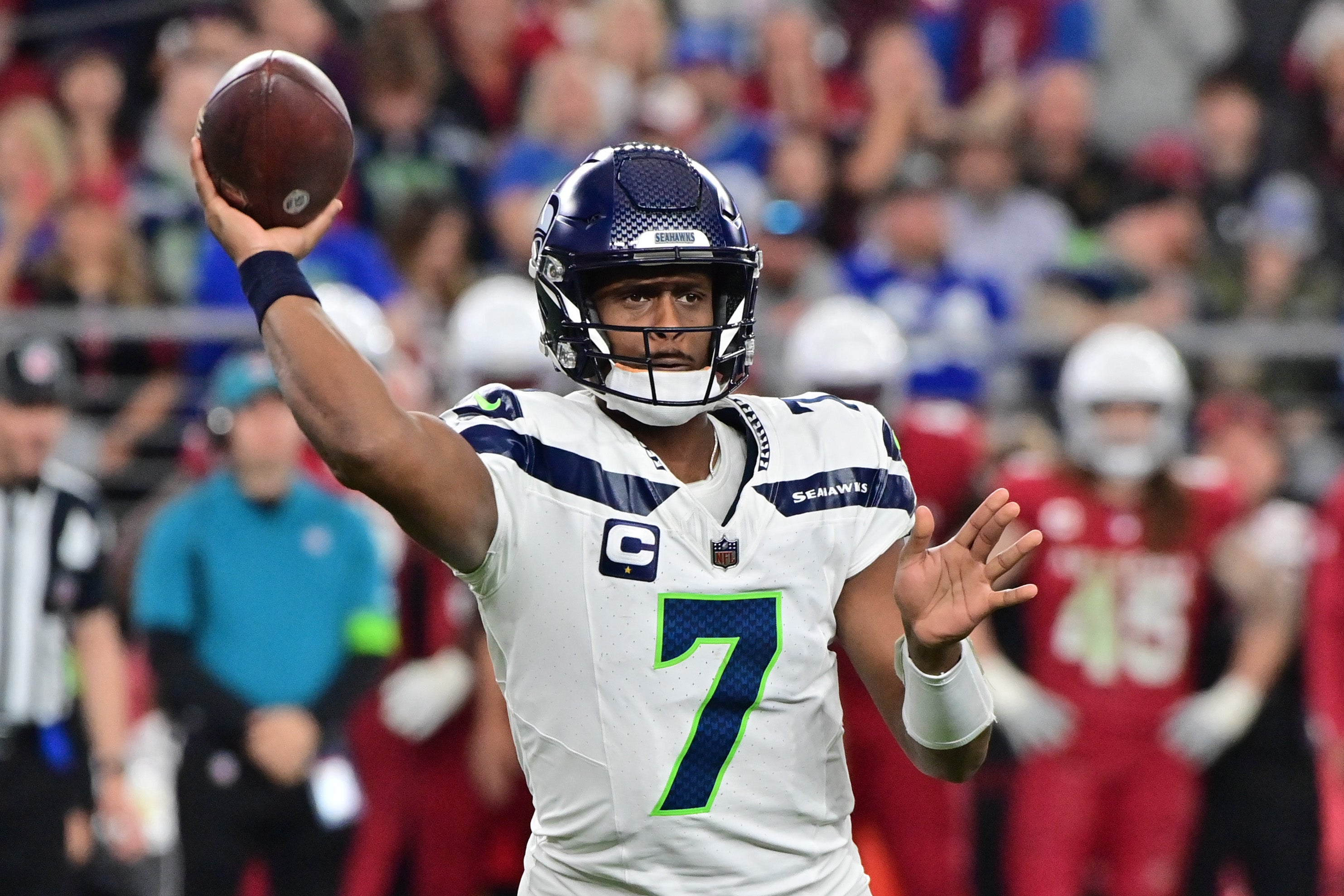 Jan 7, 2024; Glendale, Arizona, USA; Seattle Seahawks quarterback Geno Smith (7) throws in the second half against the Arizona Cardinals at State Farm Stadium.