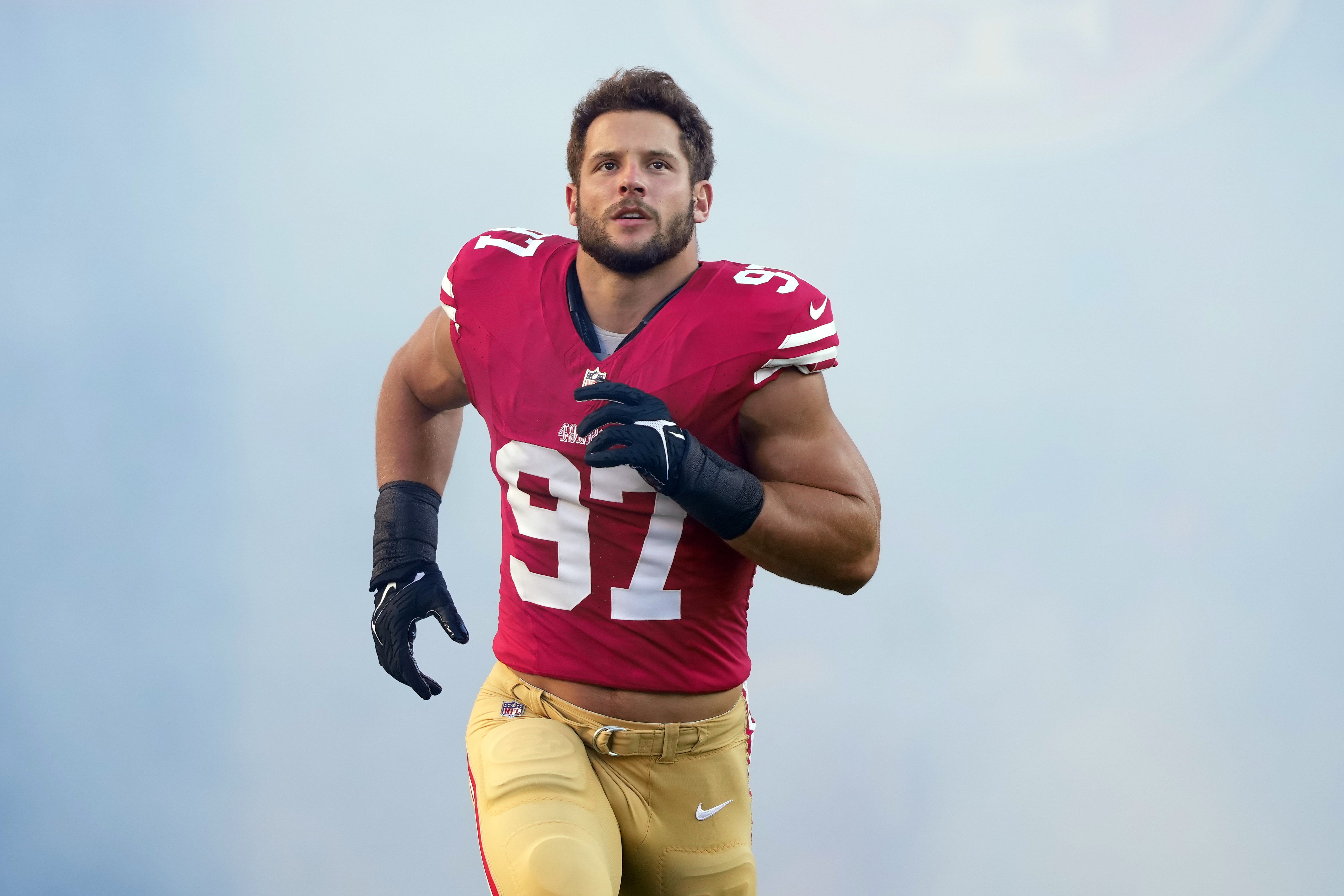 Oct 8, 2023; Santa Clara, California, USA; San Francisco 49ers defensive end Nick Bosa (97) jogs on the field before the game against the Dallas Cowboys at Levi's Stadium.