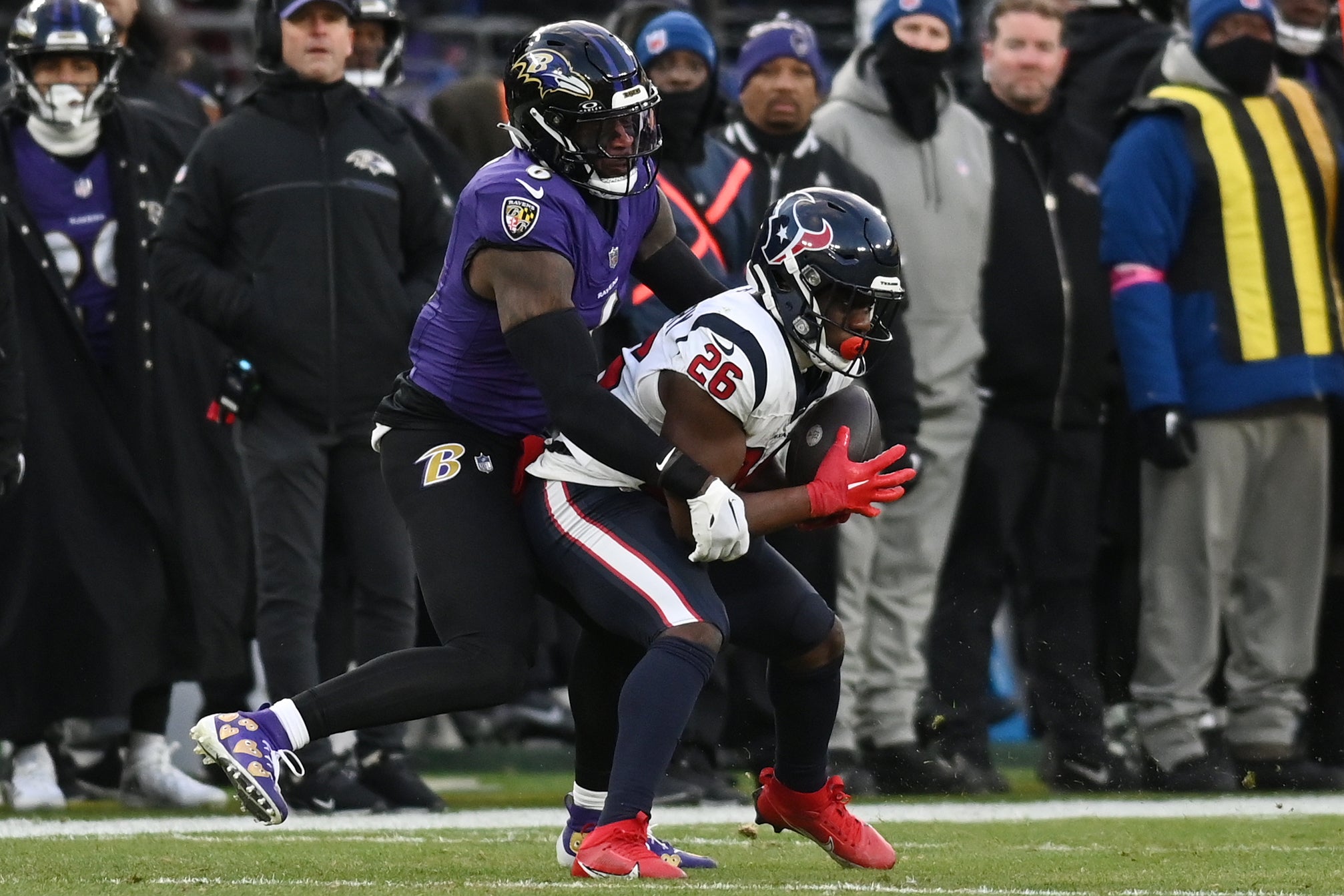 Jan 20, 2024; Baltimore, MD, USA; Houston Texans running back Devin Singletary (26) makes a catch for a first down against Baltimore Ravens linebacker Patrick Queen (6) during the first quarter of a 2024 AFC divisional round game at M&T Bank Stadium. Mandatory Credit: Tommy Gilligan-USA TODAY Sports