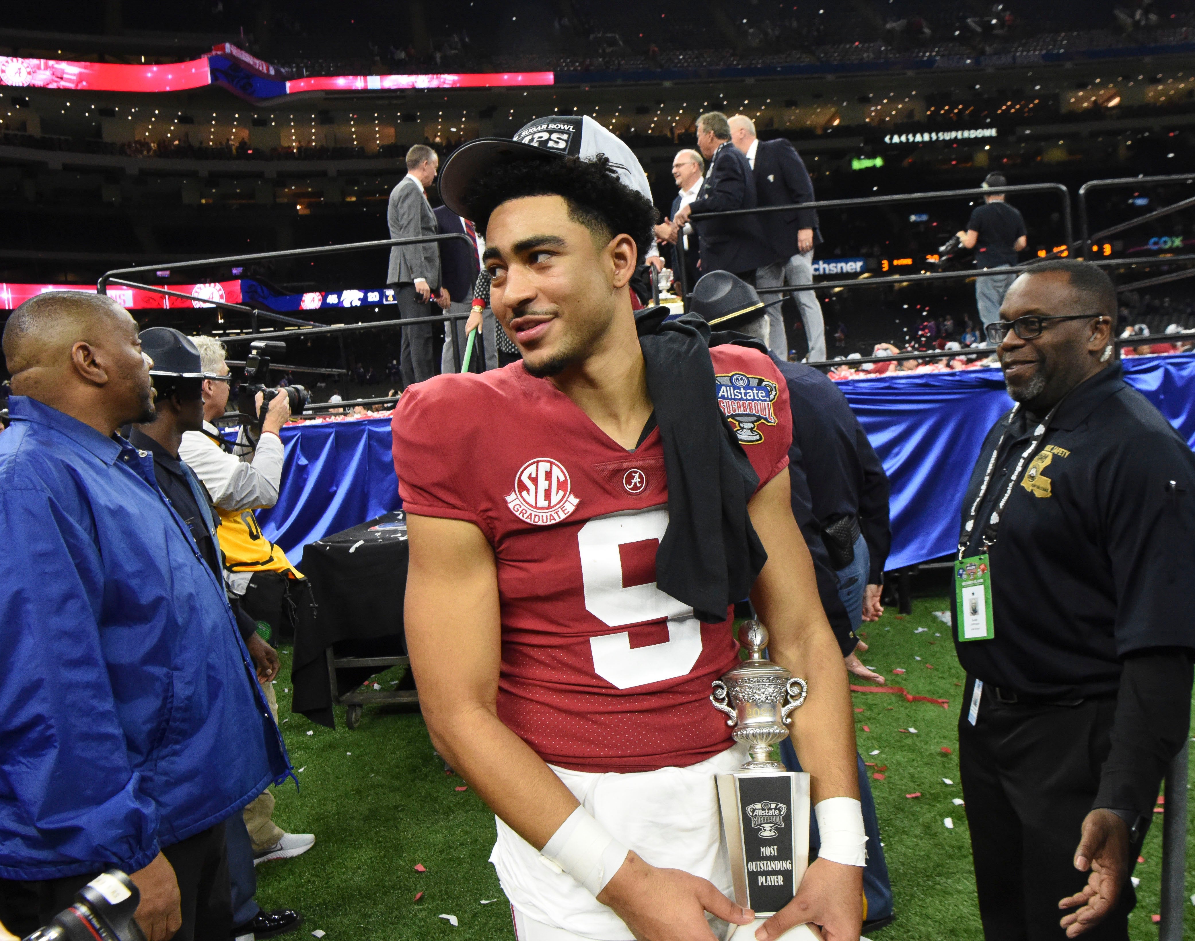 Dec 31, 2022; New Orleans, LA, USA; Alabama quarterback Bryce Young (9) carries away the MVP trophy after throwing five touchdown passes during the 2022 Sugar Bowl at Caesars Superdome. Alabama defeated Kansas State 45-20. Mandatory Credit: Gary Cosby Jr.-USA TODAY Sports