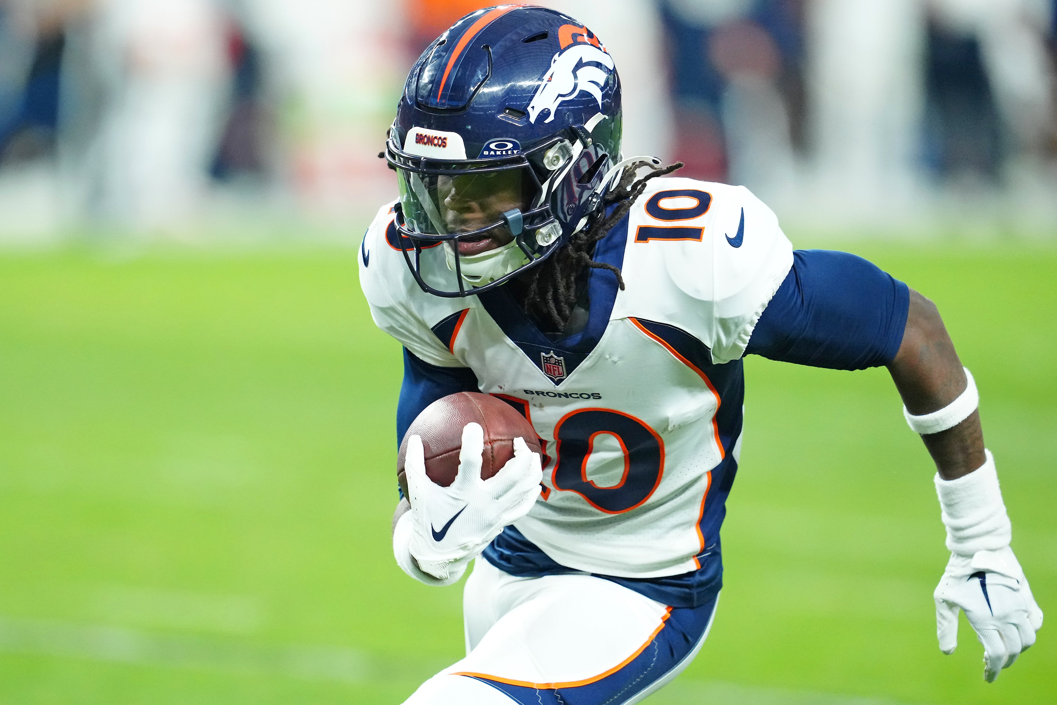 Jan 7, 2024; Paradise, Nevada, USA; Denver Broncos wide receiver Jerry Jeudy (10) gains yardage against the Las Vegas Raiders during the fourth quarter at Allegiant Stadium. Mandatory Credit: Stephen R. Sylvanie-USA TODAY Sports