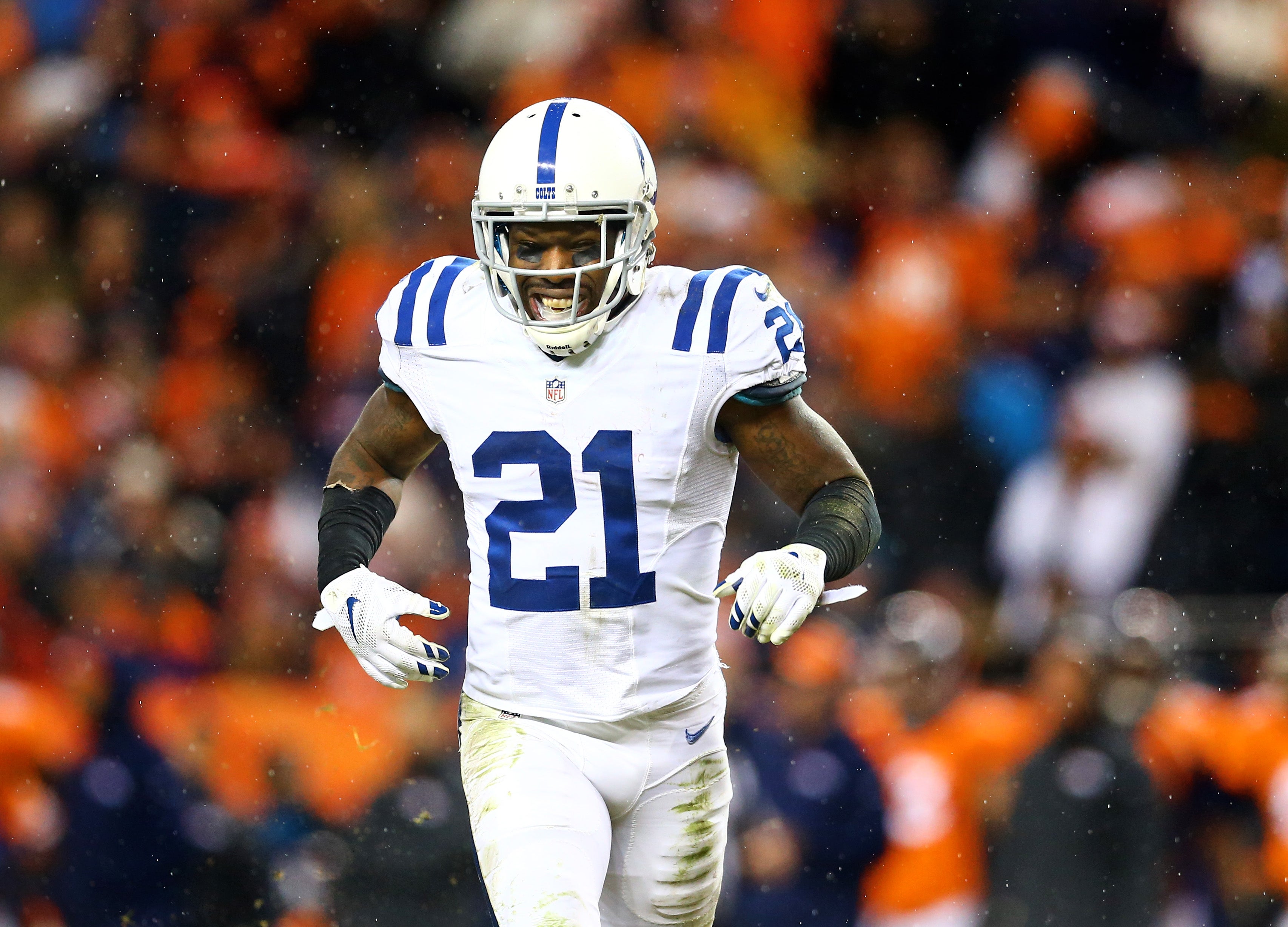 Jan 11, 2015; Denver, CO, USA; Indianapolis Colts cornerback Vontae Davis (21) reacts against the Denver Broncos in the 2014 AFC Divisional playoff football game at Sports Authority Field at Mile High. The Colts defeated the Broncos 24-13.