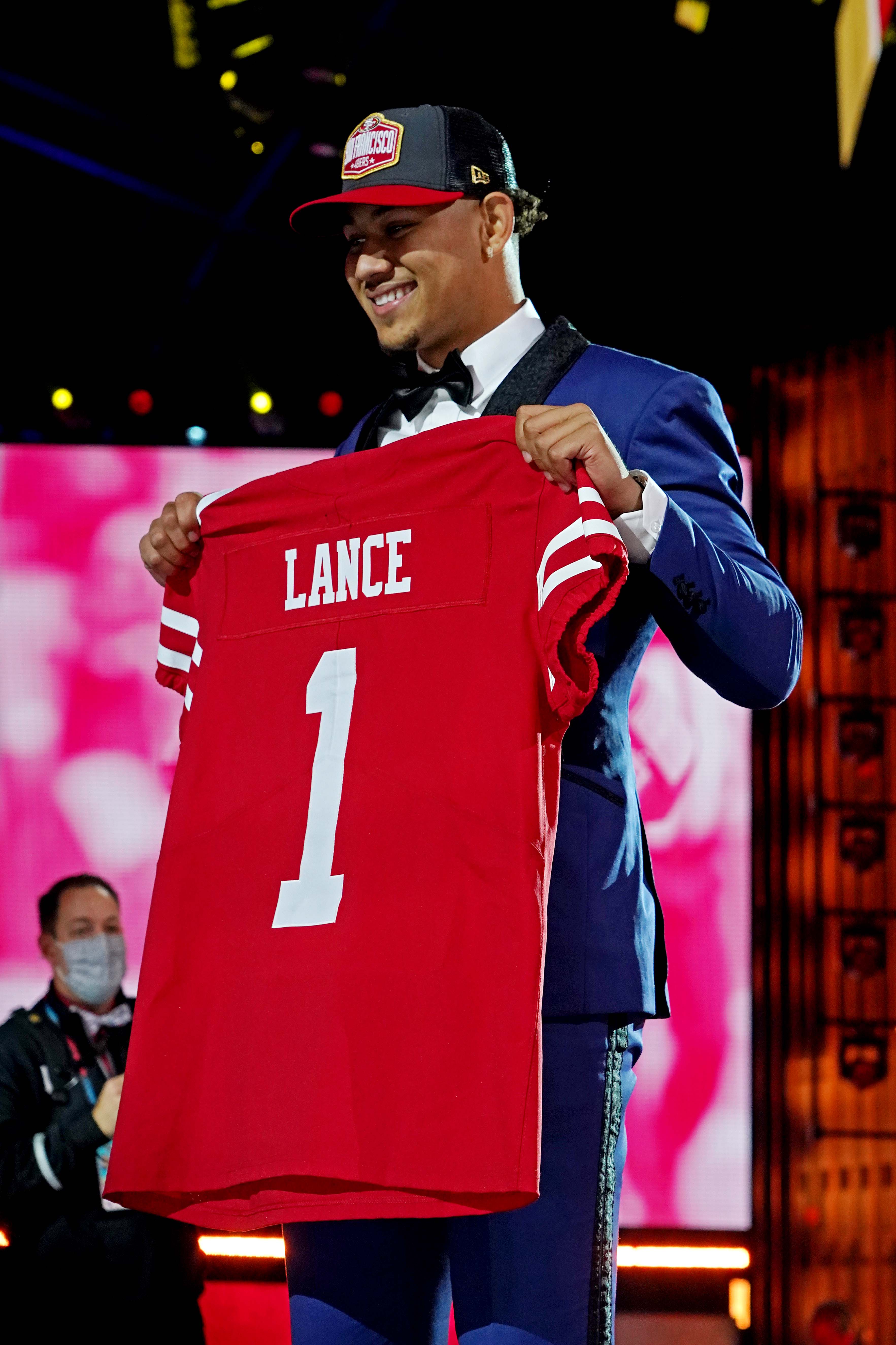 Apr 29, 2021; Cleveland, Ohio, USA; Trey Lance (North Dakota State) poses with a jersey after being selected by the San Francisco 49ers as the number three overall pick in the first round of the 2021 NFL Draft at First Energy Stadium.