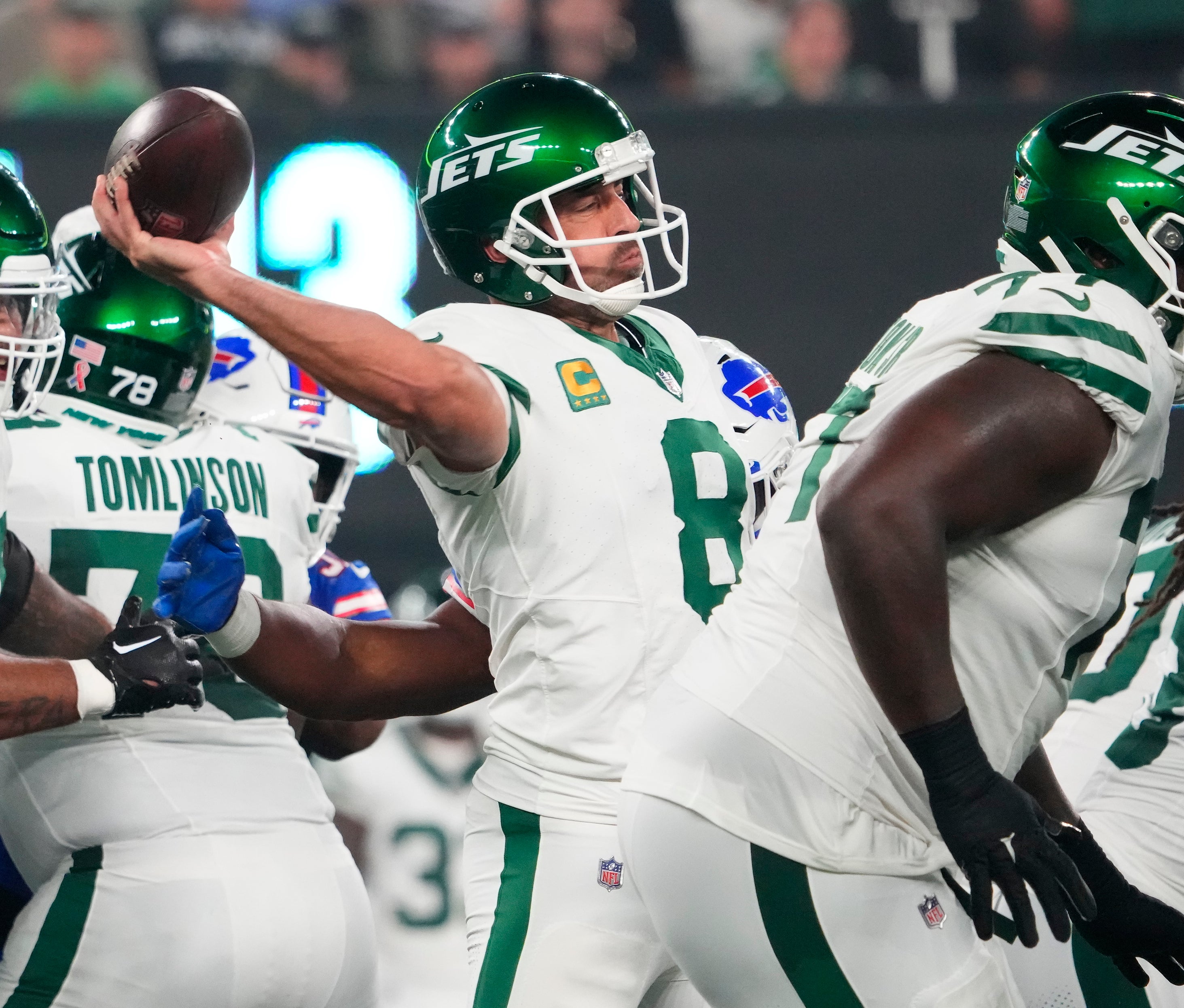 New York Jets quarterback Aaron Rodgers (8) throws under pressure against the Bills during the first half at MetLife Stadium.